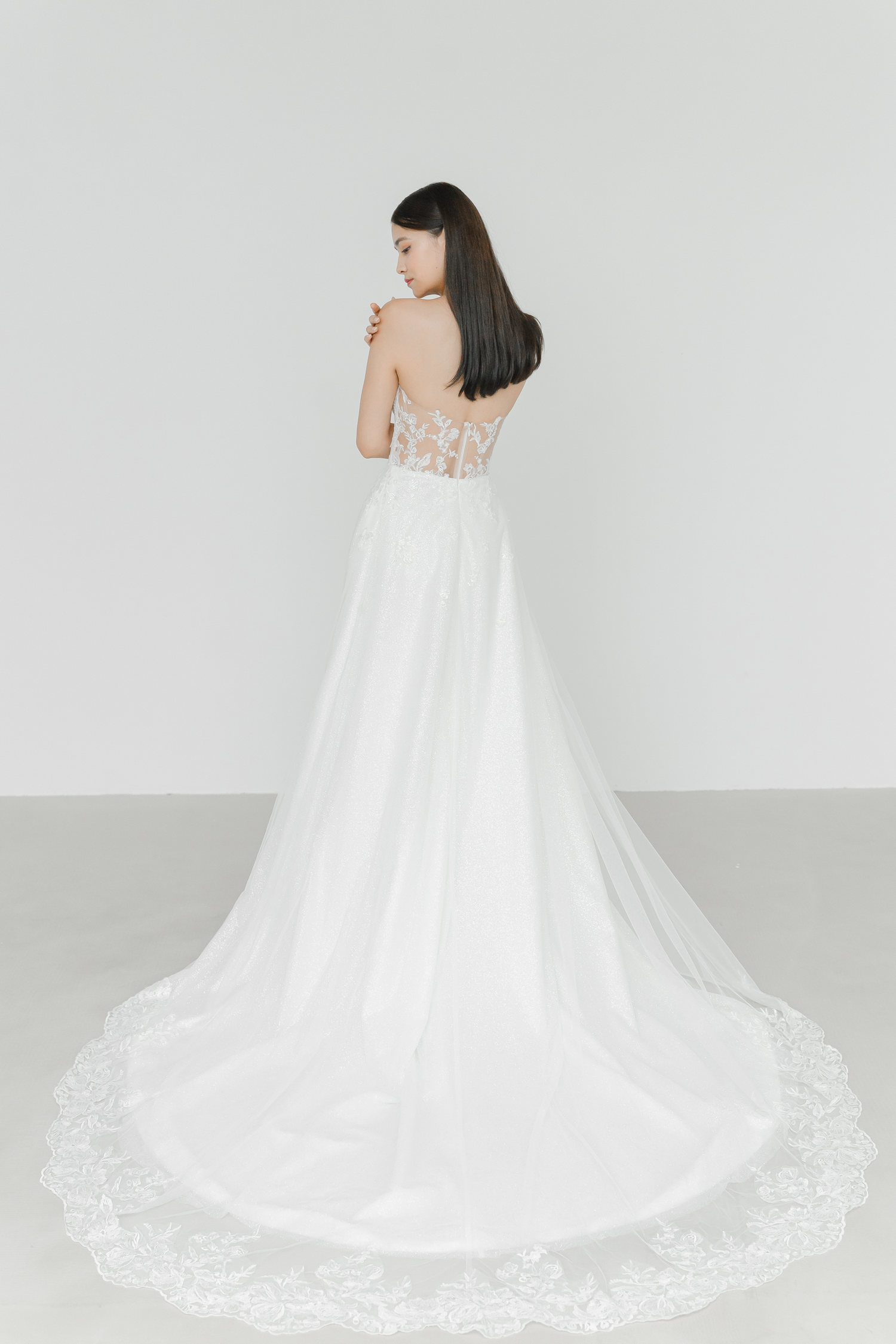 Cyra bridal gown back view with an exquisitely detailed illusion back