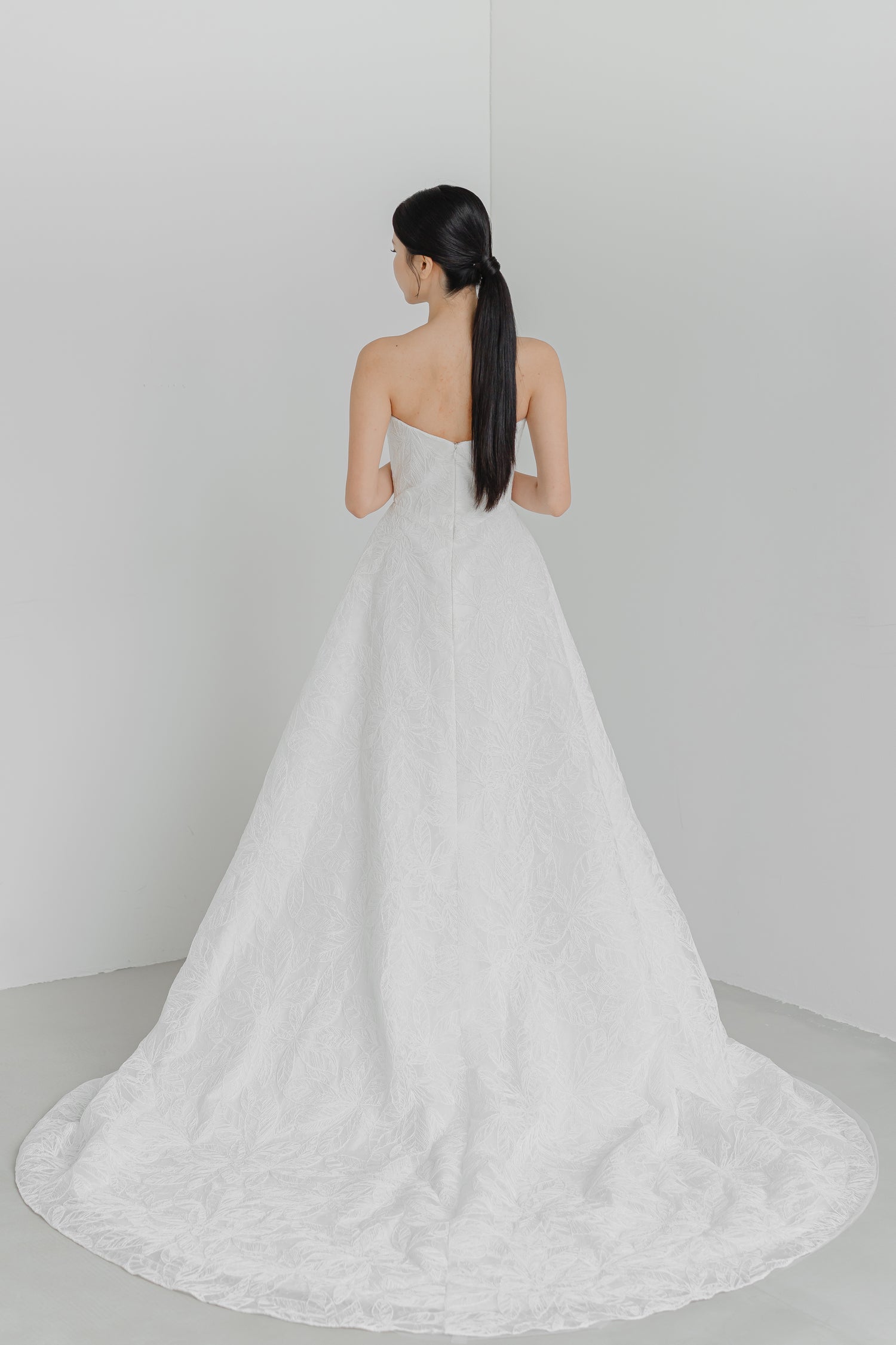 Dakota wedding gown train showcasing the elegant lace detailing and flowing train