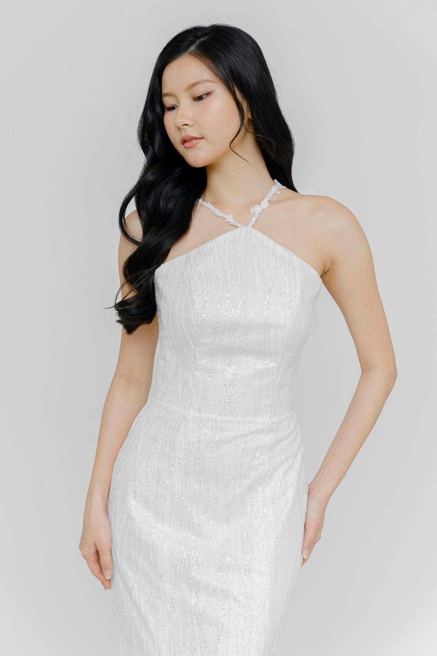 Close-up of Dinna bridal gown showcasing the elegant cross halter neckline