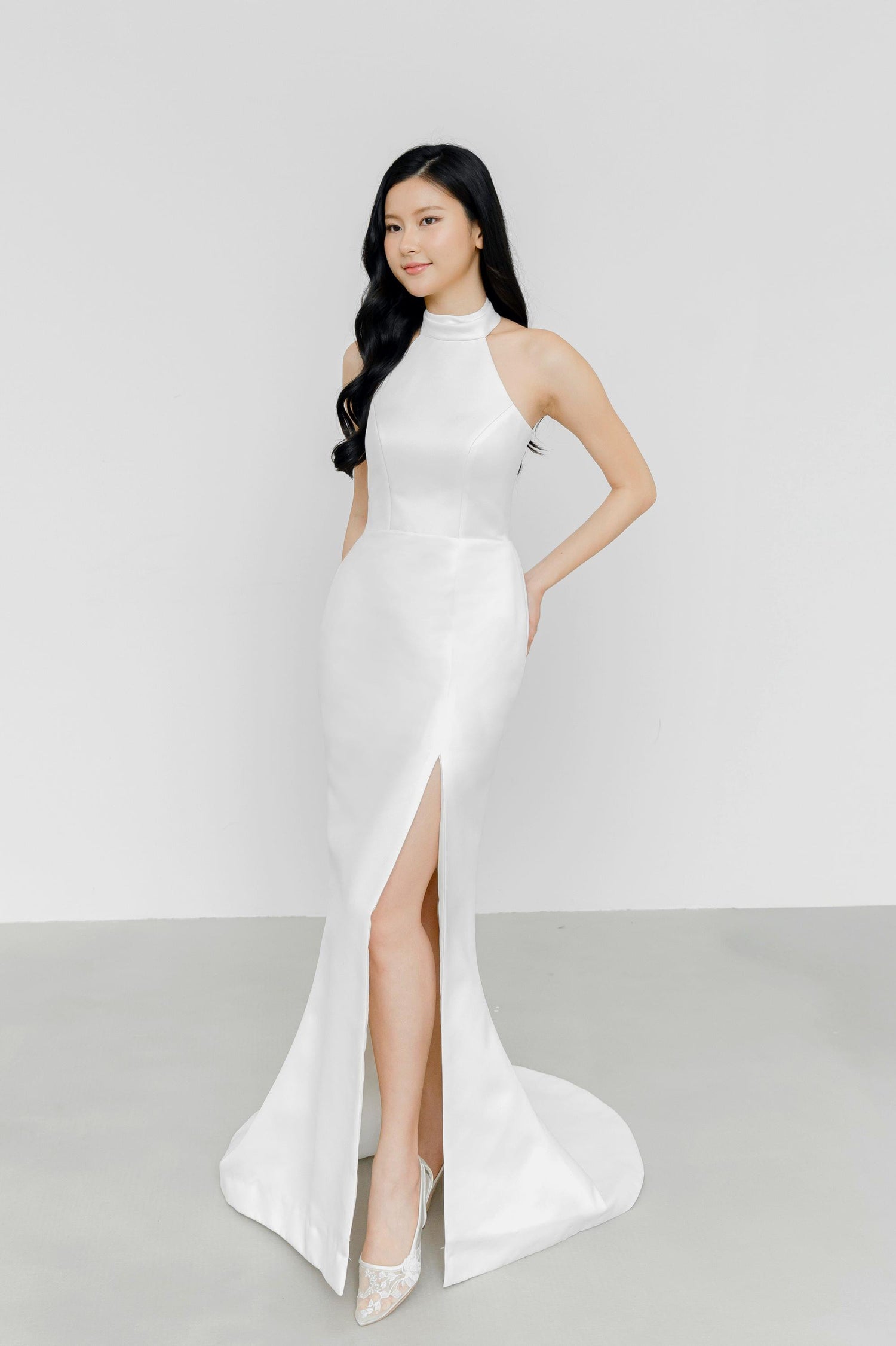 Eberlyn wedding dress featuring a minimalist satin design and modern front slit
