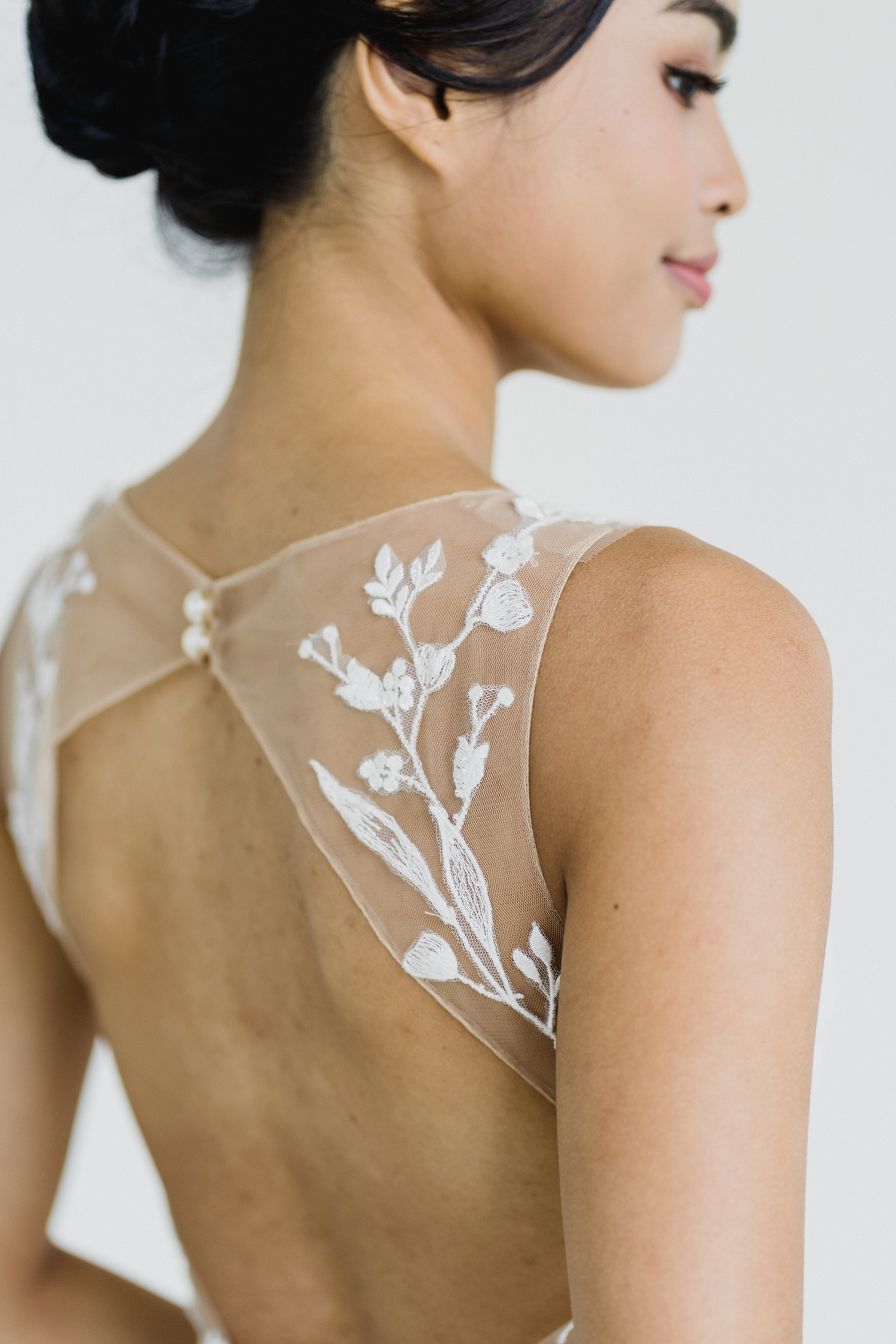Close-up of Edith bridal dress with delicate lace and illusion neckline