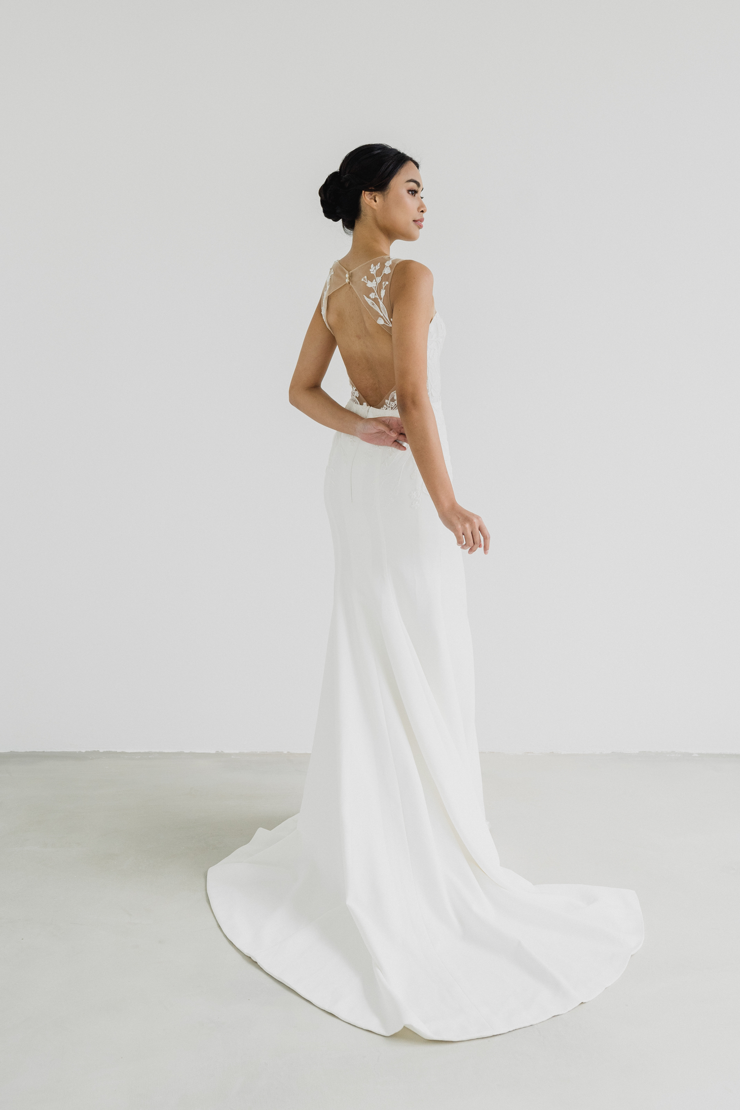 Edith bridal gown back view with an elegant diamond lace back