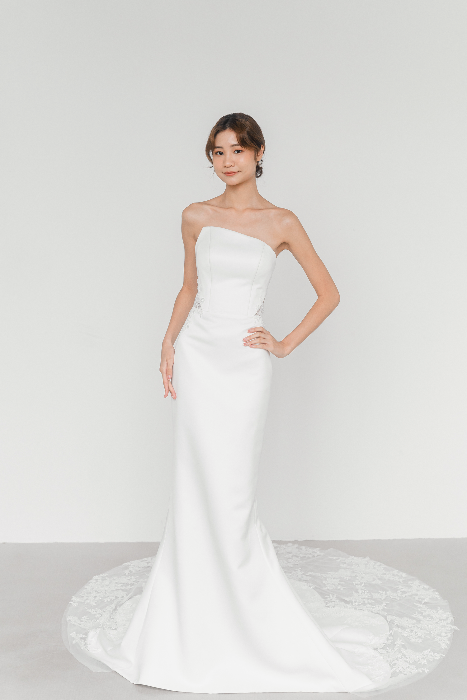 Eleanor bridal gown featuring illusion lace accents and modern asymmetry