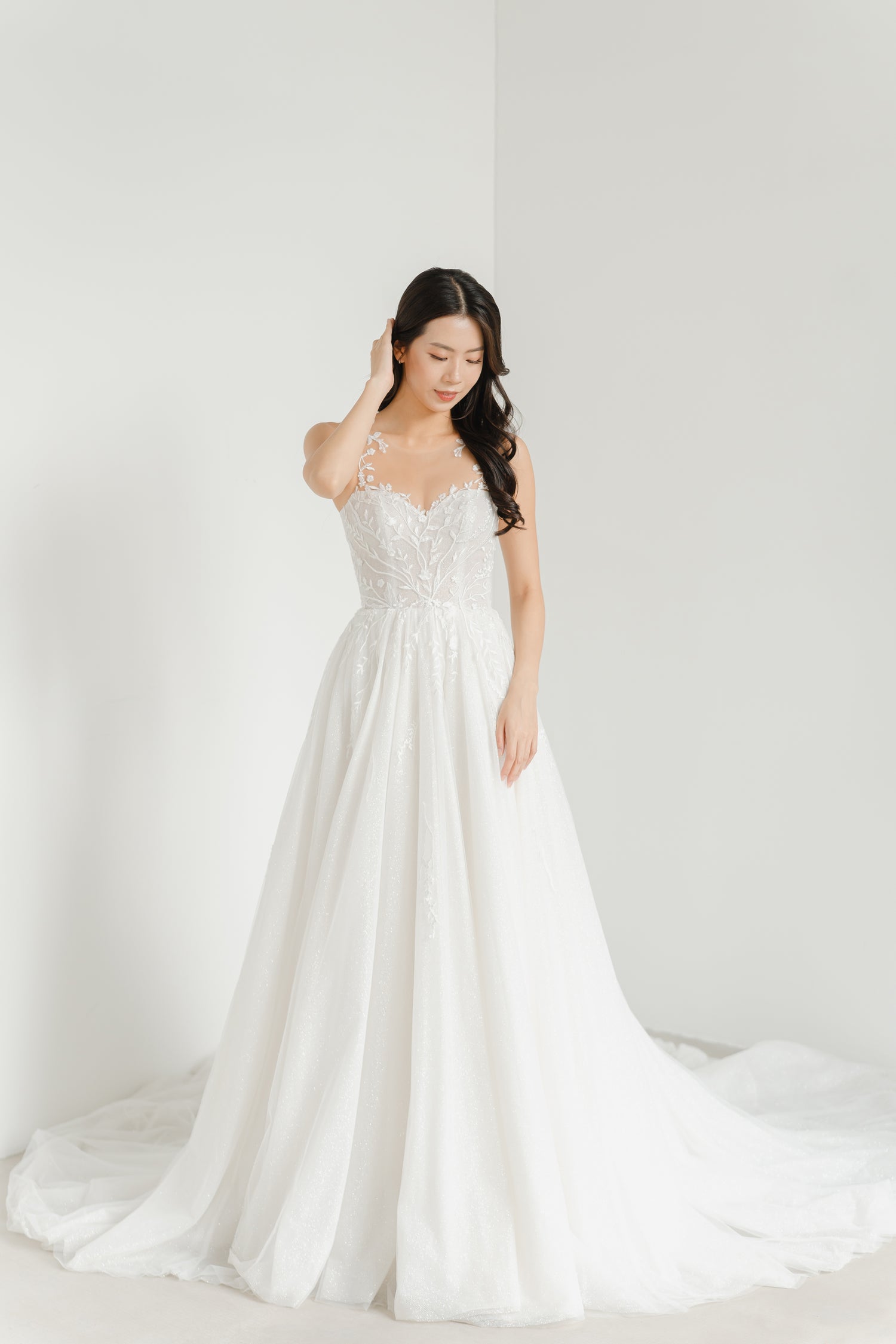 Elisha bridal gown front view with an illusion neckline and light ballgown silhouette