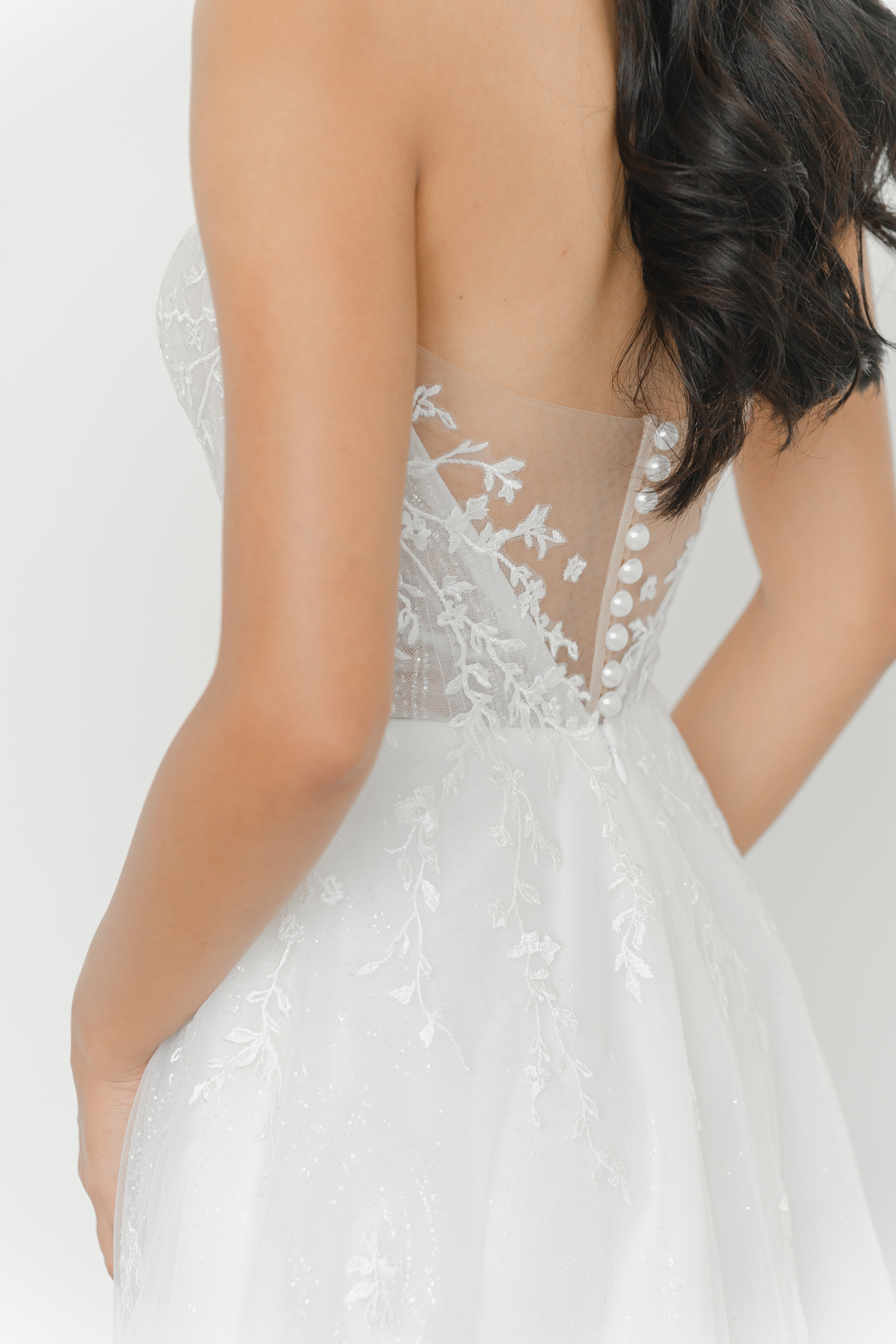 Close-up of Ellery wedding dress with delicate shimmering detailing