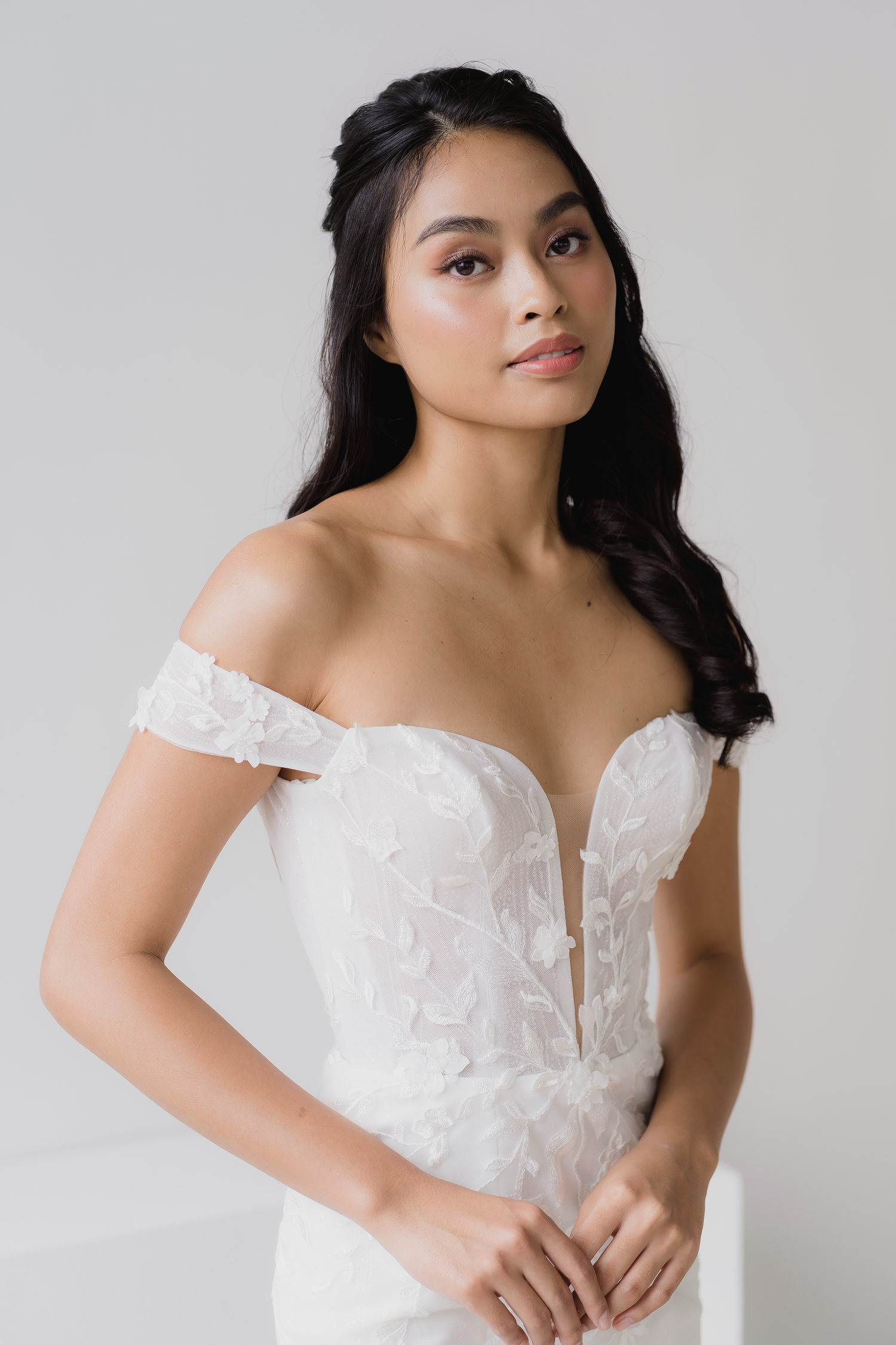 Close-up of Elyse bridal gown with soft off-shoulder sleeves