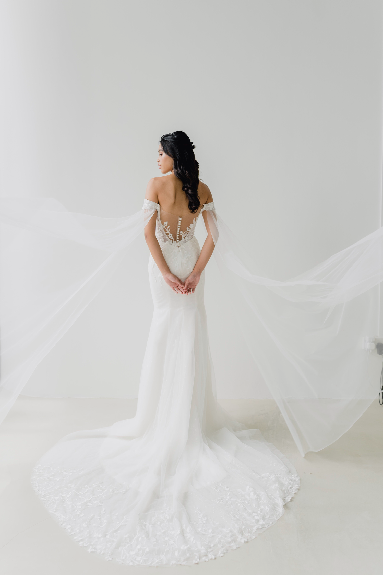 Elyse wedding dress styled with a detachable tulle cape