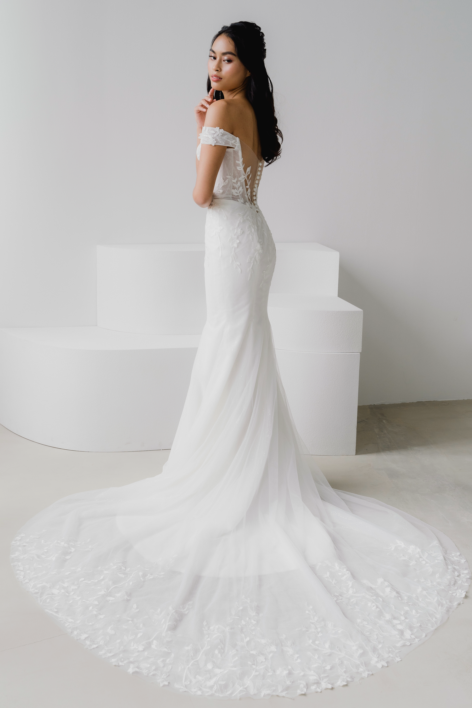 Elyse wedding dress side view with a fitted mermaid silhouette