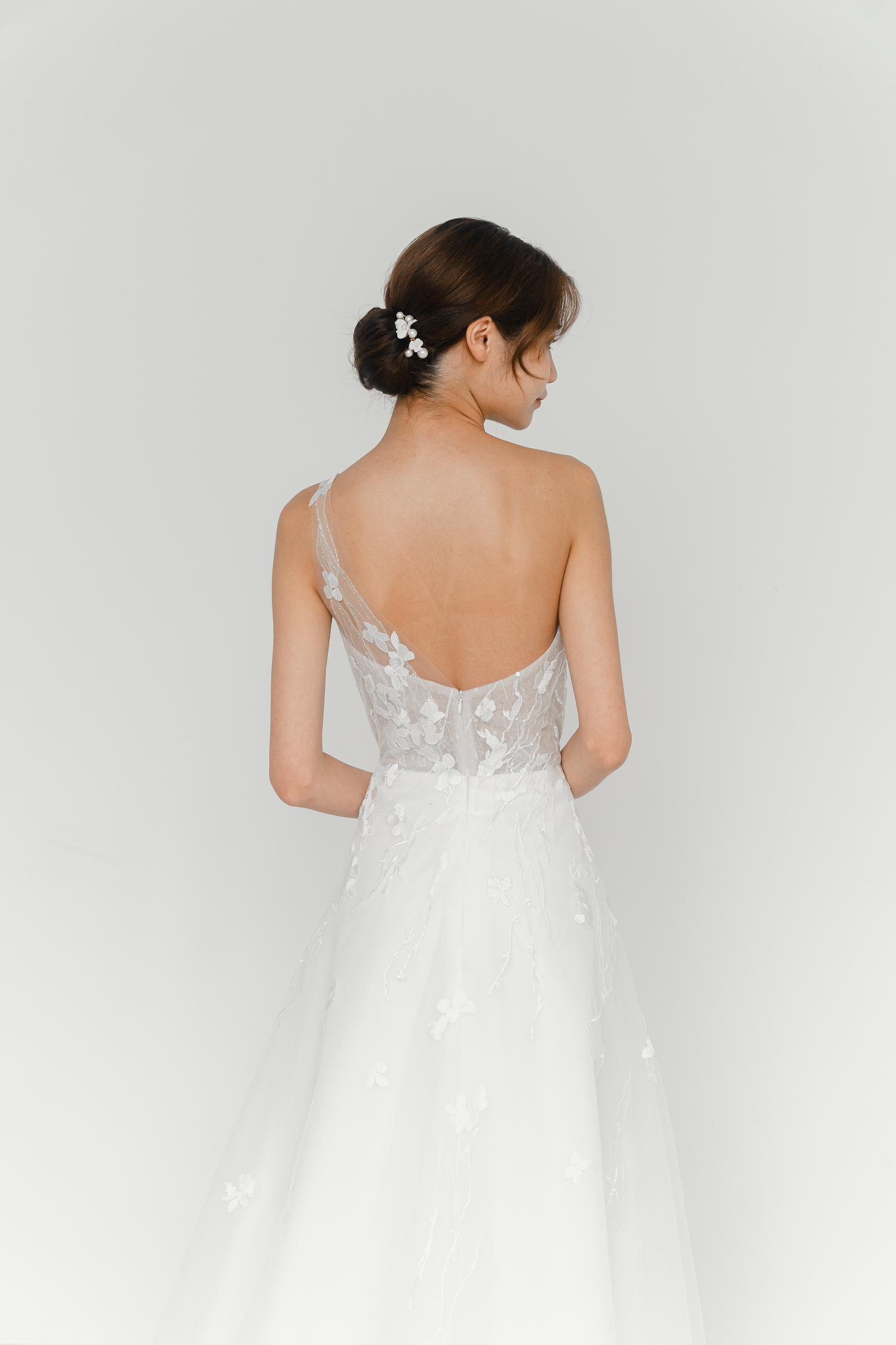 Close-up of Emelia wedding gown with delicate lace detailing