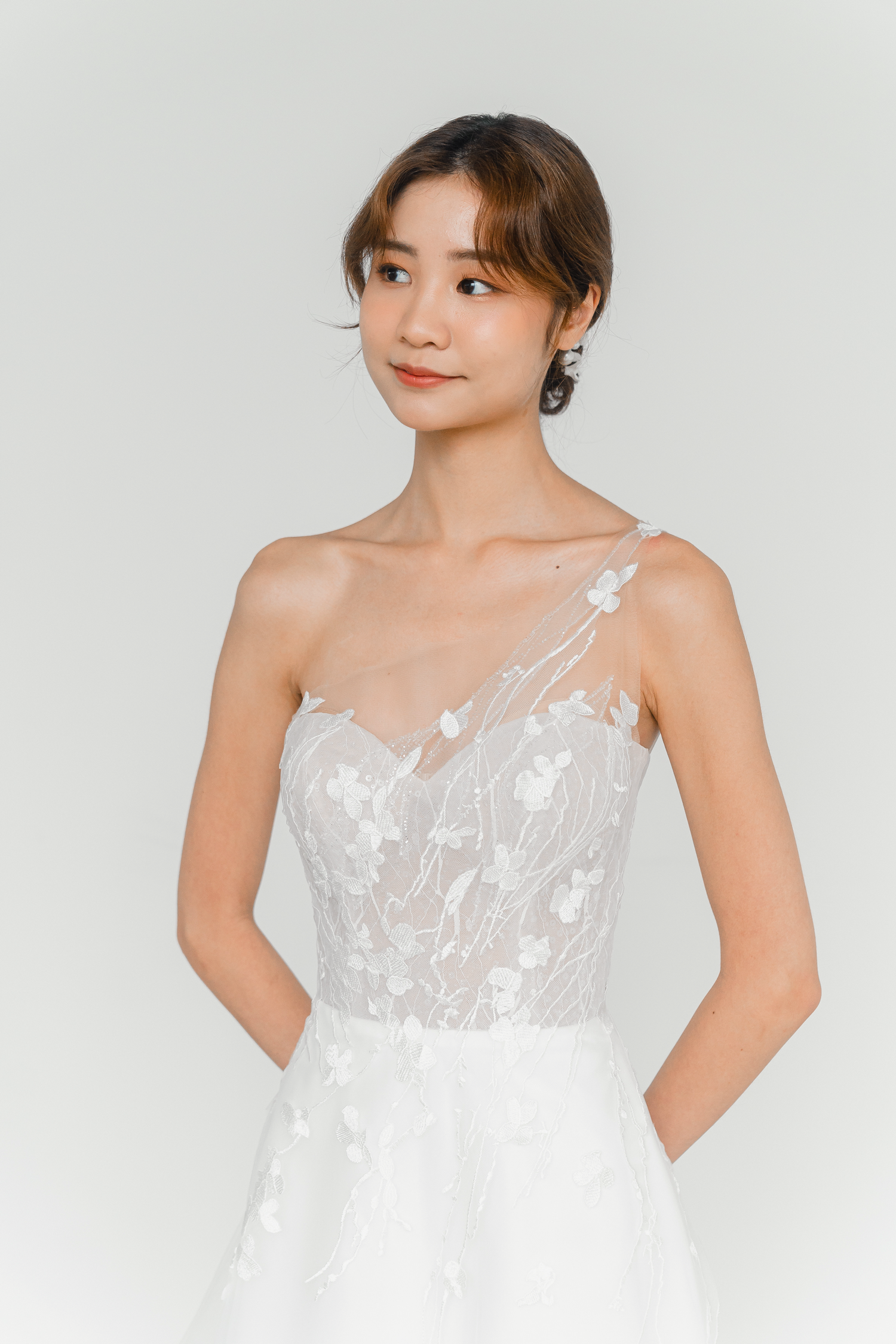 Emelia wedding gown side view with a soft tulle silhouette