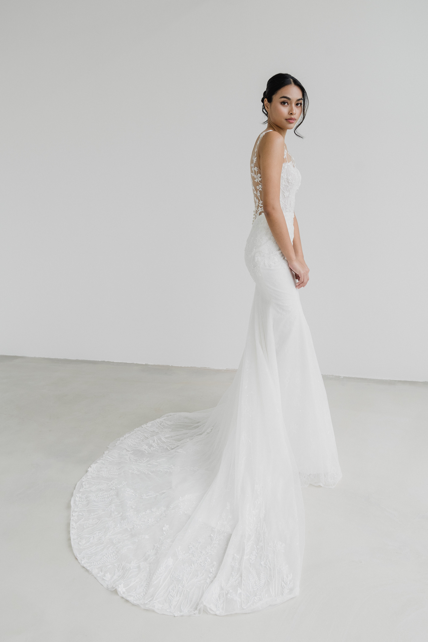 Erica bridal gown side view with a fitted mermaid silhouette