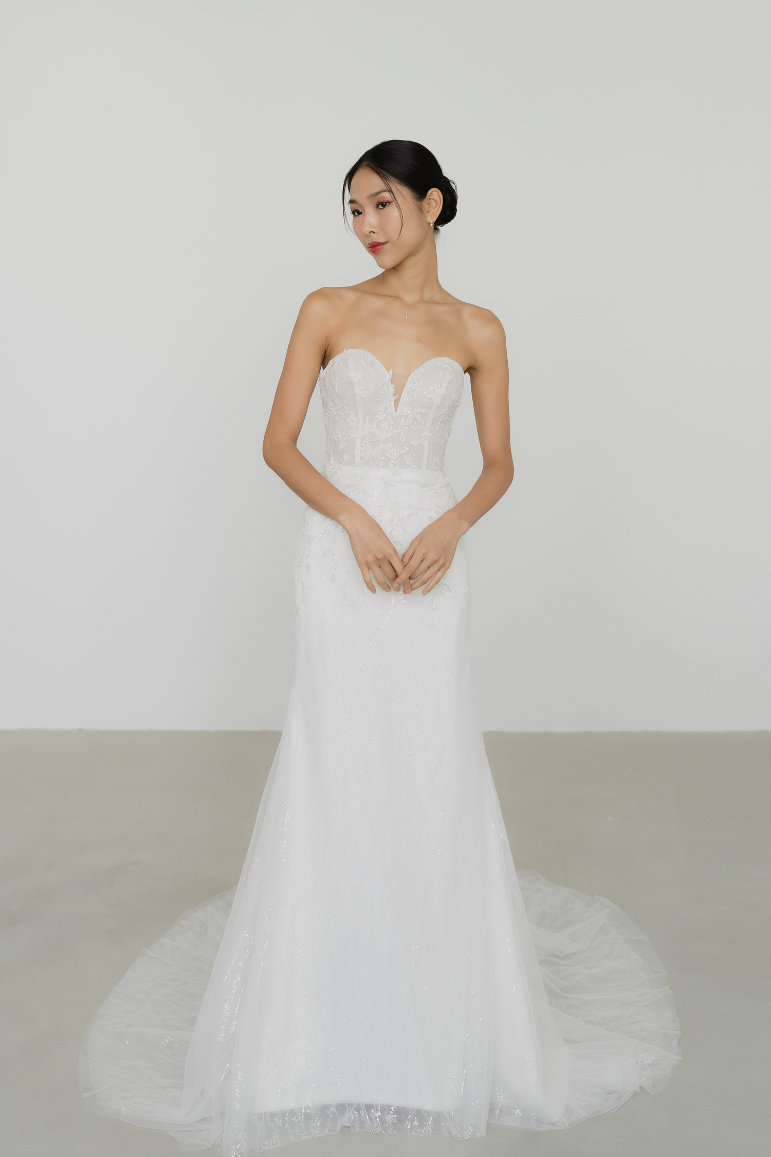 Esme bridal gown featuring beaded leafy lace motifs across the bodice