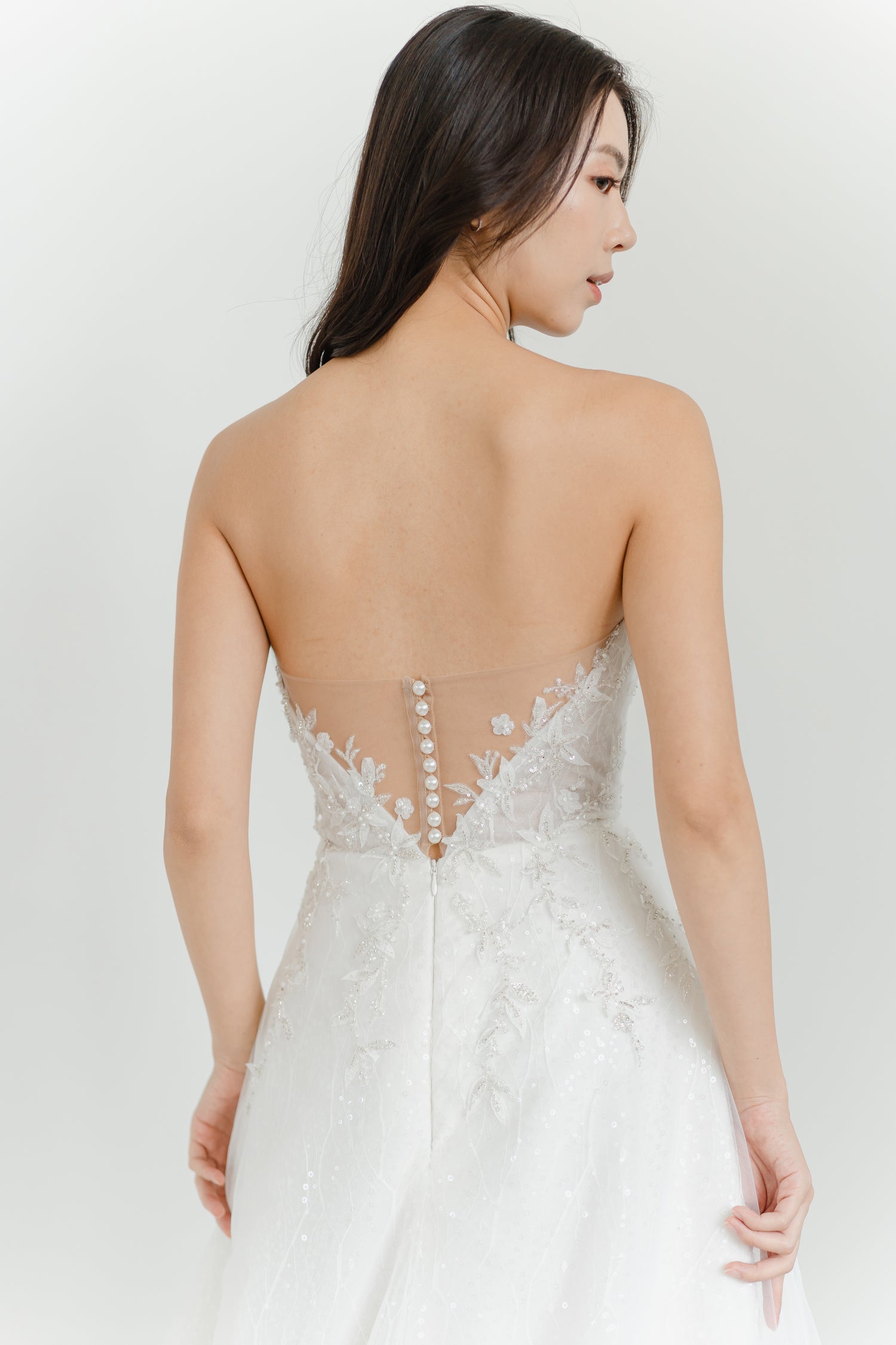 Close-up of Estee bridal gown showcasing the illusion lace back
