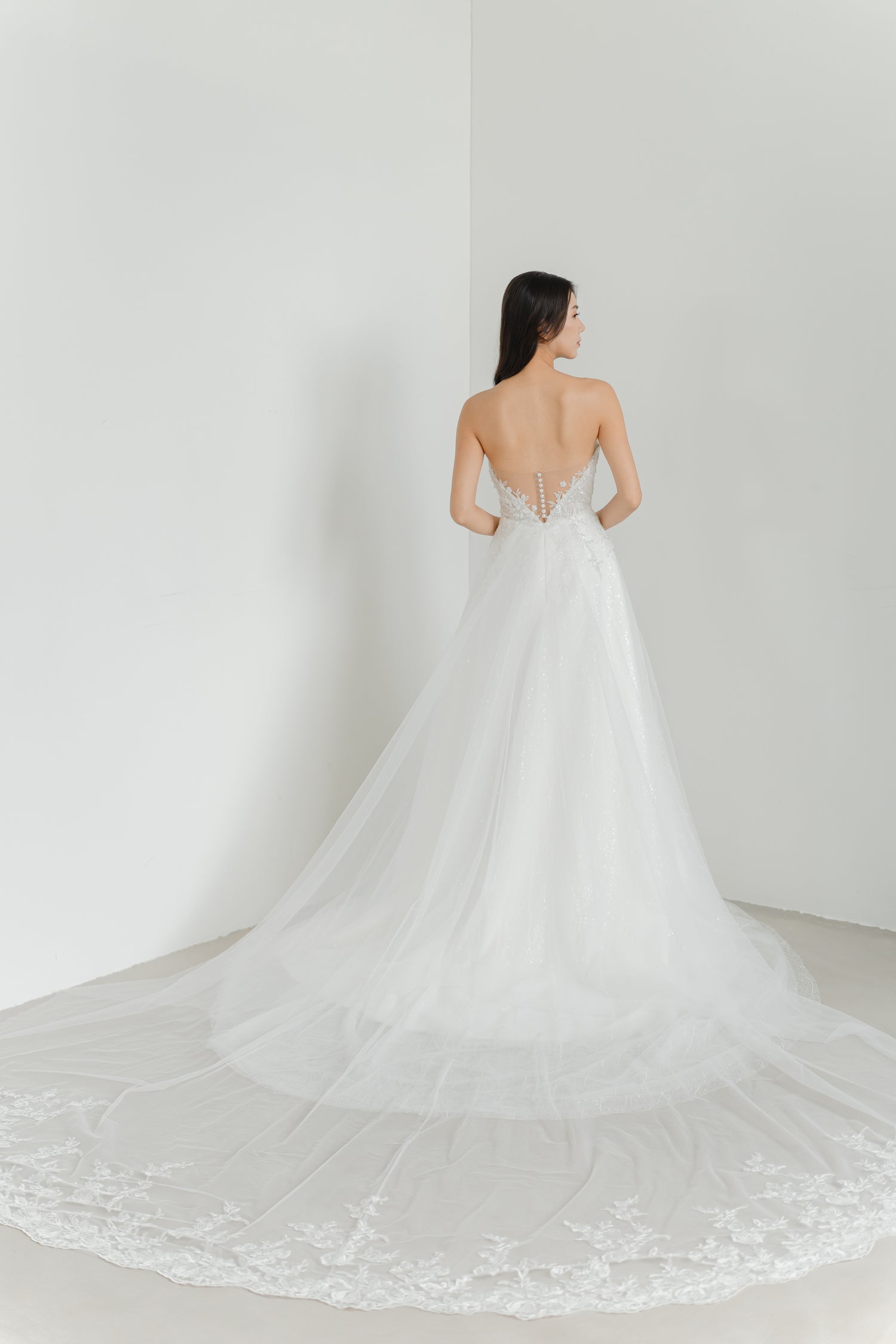 Estee wedding gown with the detachable lace train creating a dramatic bridal entrance