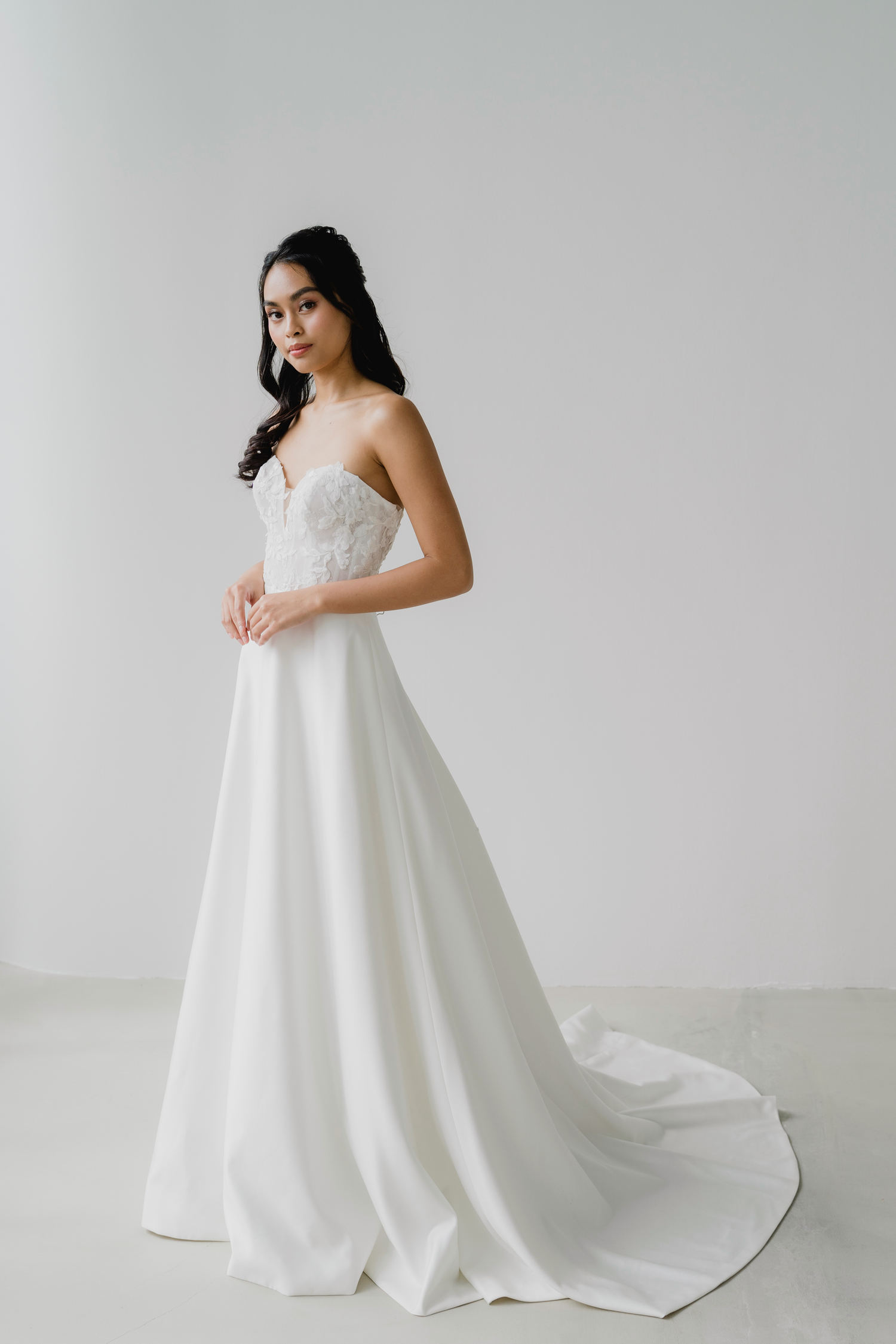 Ferlyn wedding dress front view with sweetheart neckline and floral lace bodice
