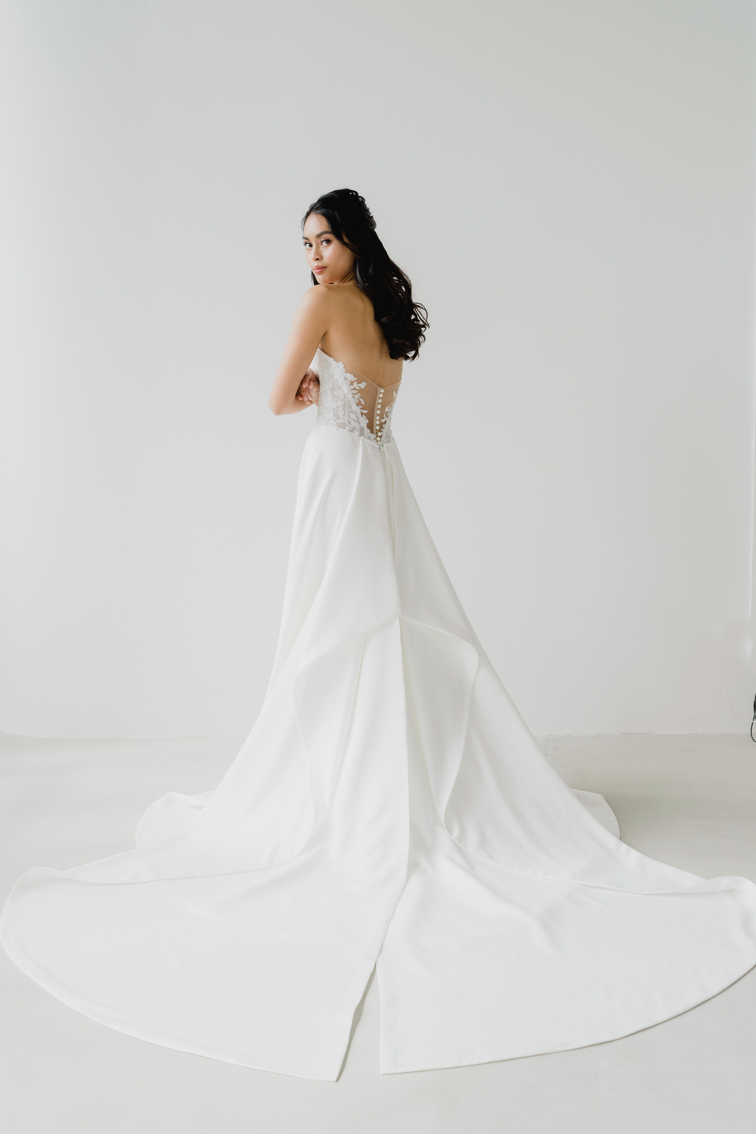 Ferlyn wedding dress styled with a detachable pleated satin train