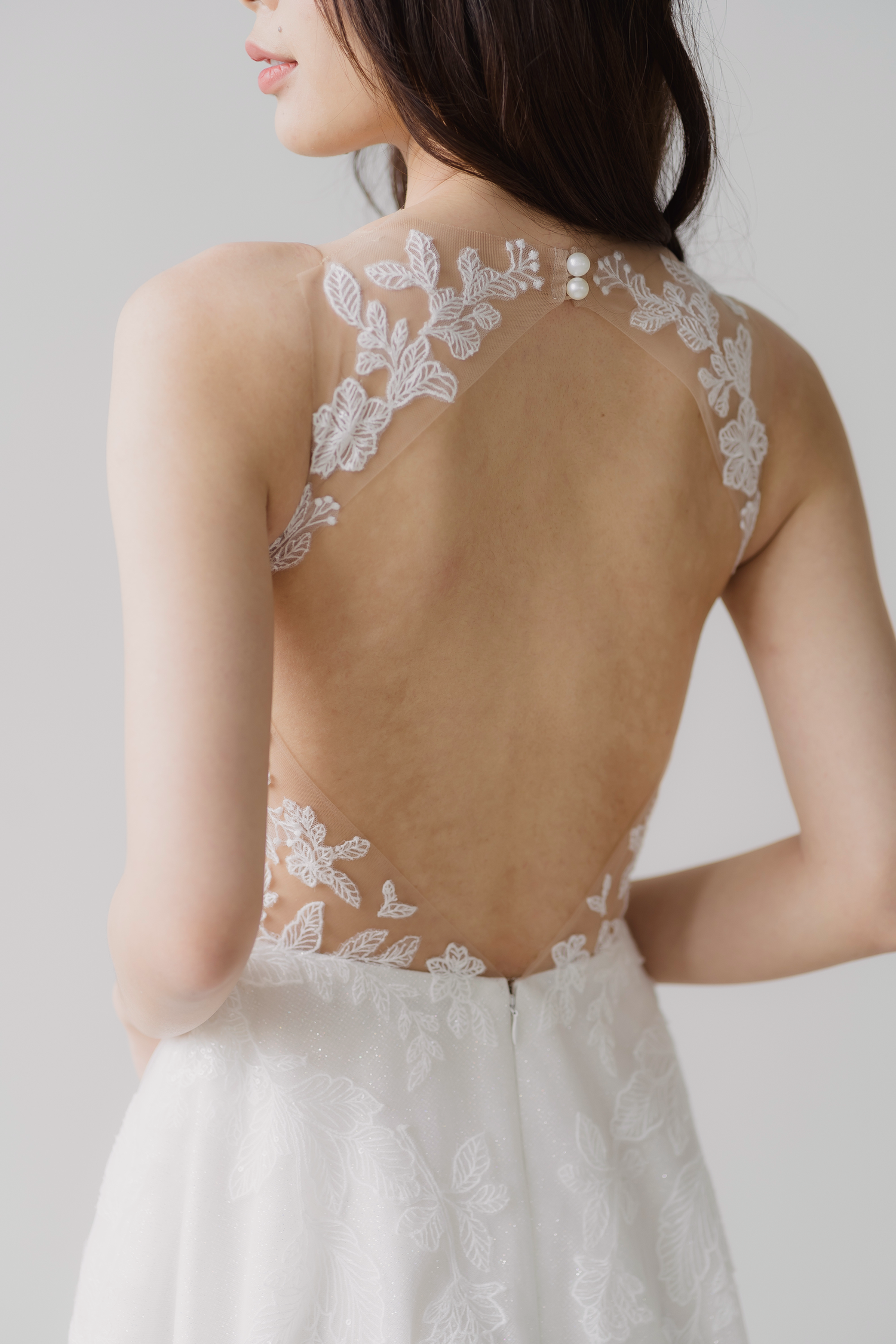 Close-up of Fiona bridal gown featuring the open diamond back