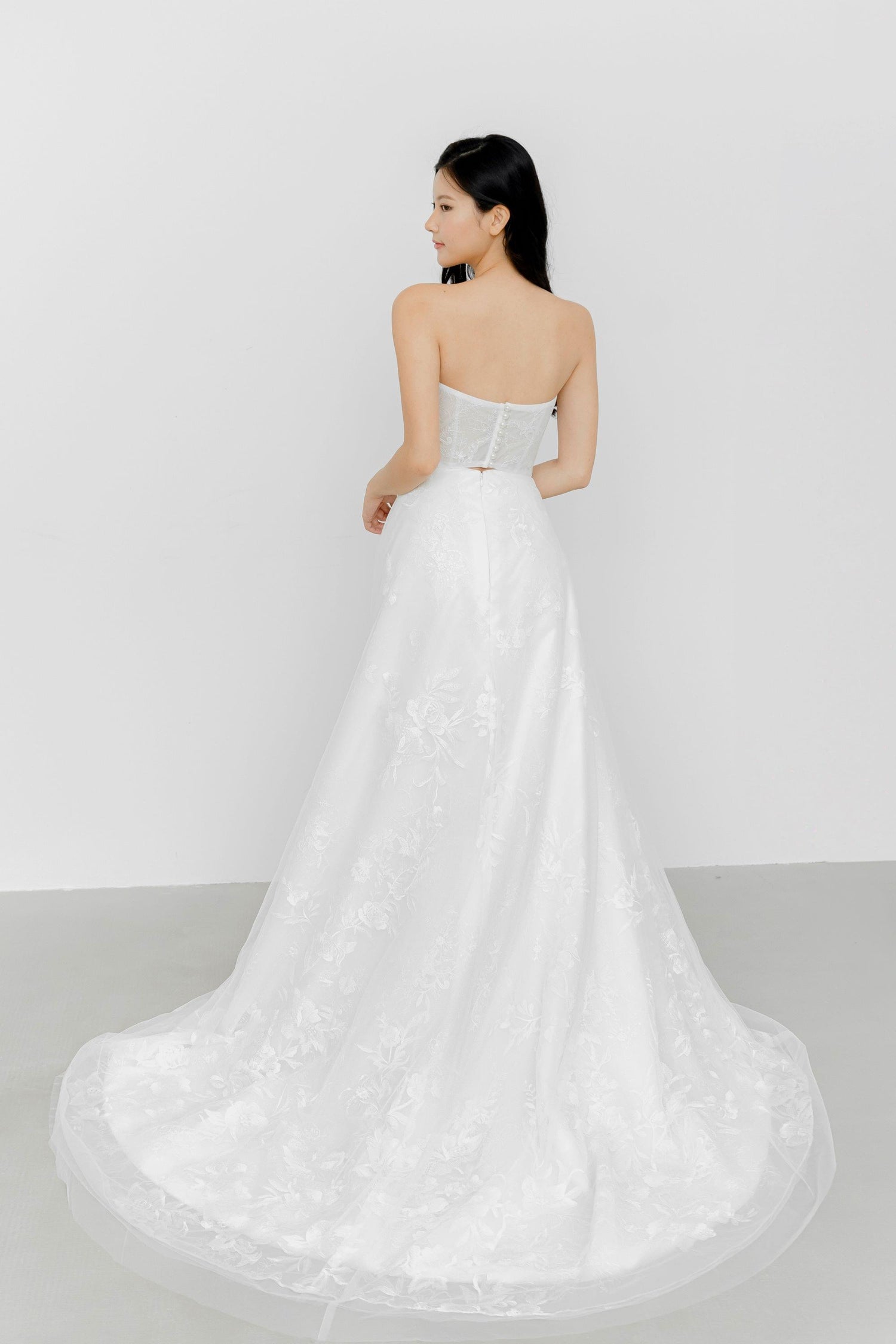 Gabriella wedding gown train showcasing the intricate full lace and graceful flowing train