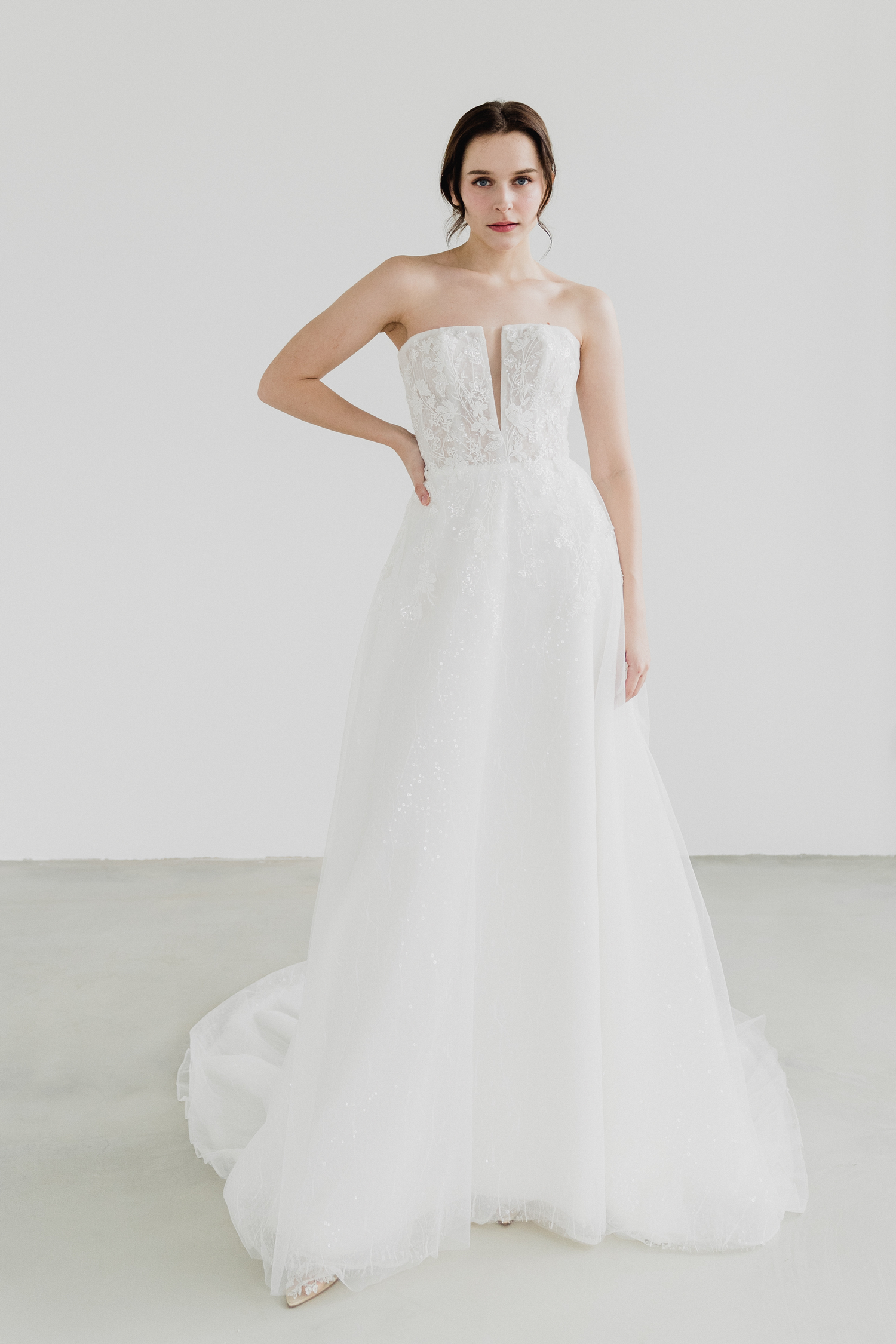 Genith bridal gown front view with straight neckline and glitter tulle