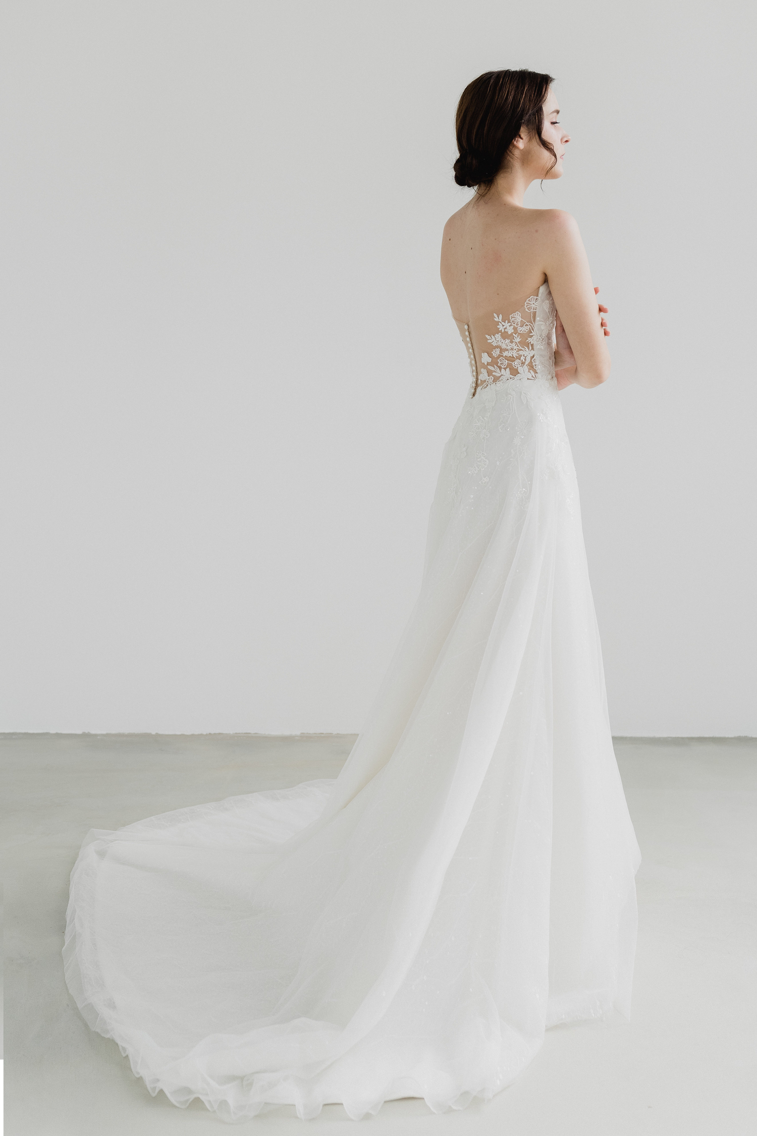 Genith bridal gown featuring delicate beaded lace extending to the back