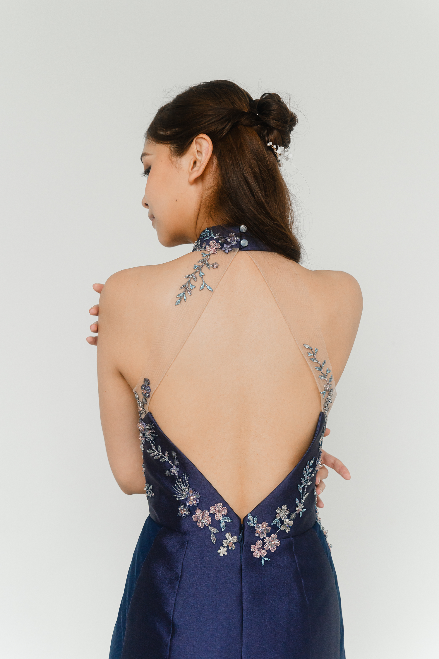 Close-up of Gilda bridal cheongsam showcasing the diamond back