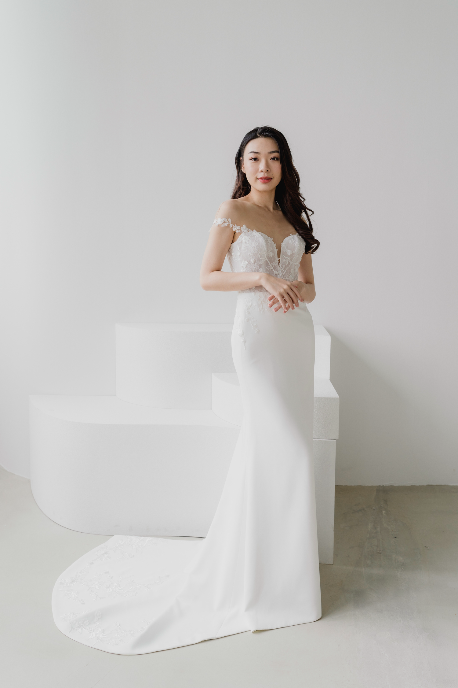 Glenna bridal gown featuring intricate floral lace and a crepe skirt