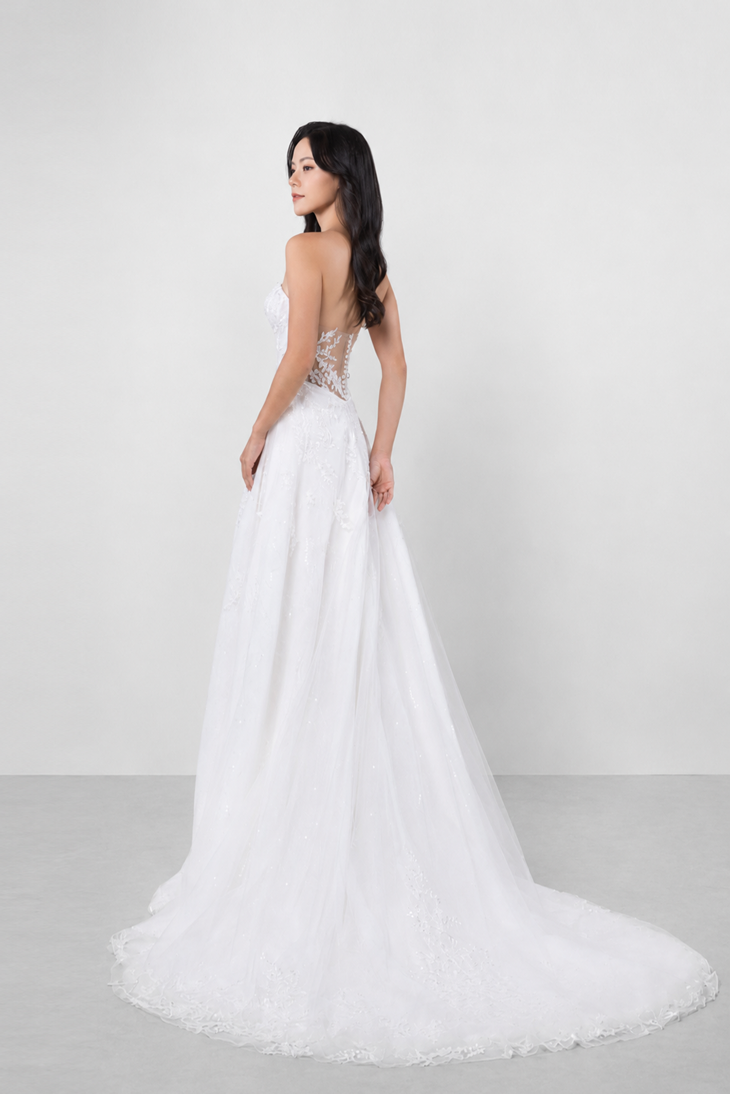 Gracie bridal gown back view with an illusion lace back and pearl button accents