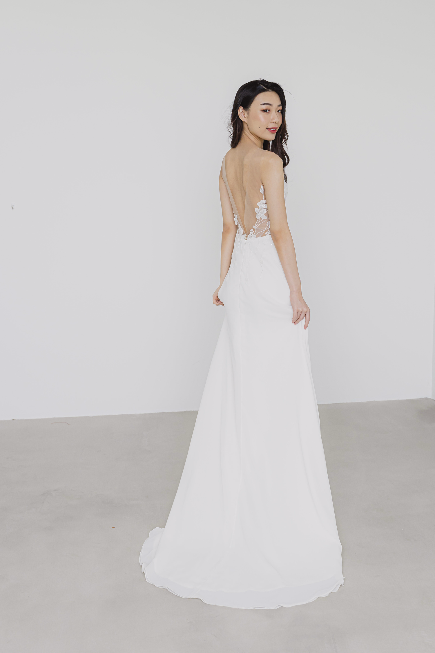 Hannah wedding gown side view with a flowing A-line skirt
