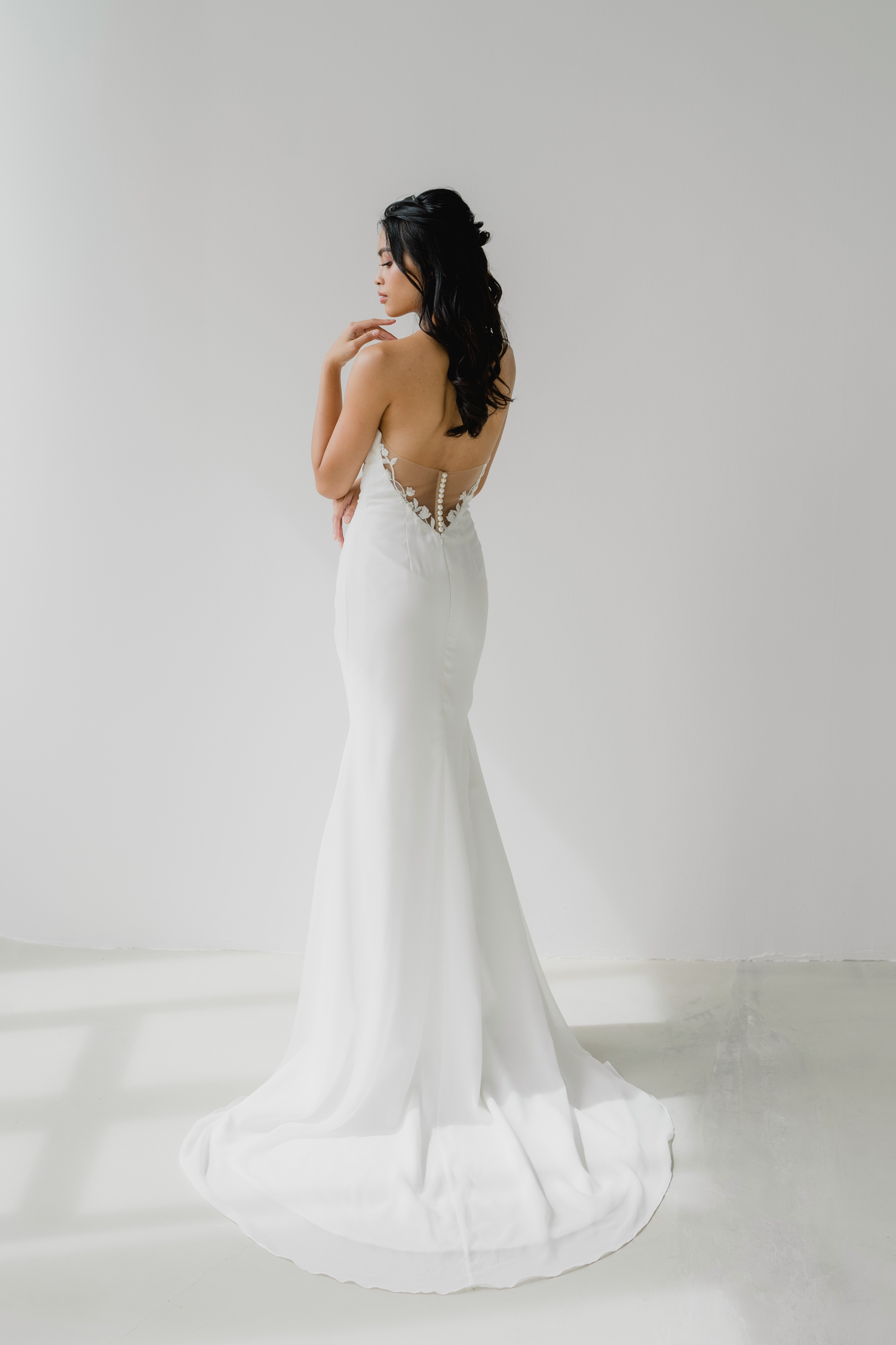 Heidi wedding dress side view with a clean fitted silhouette