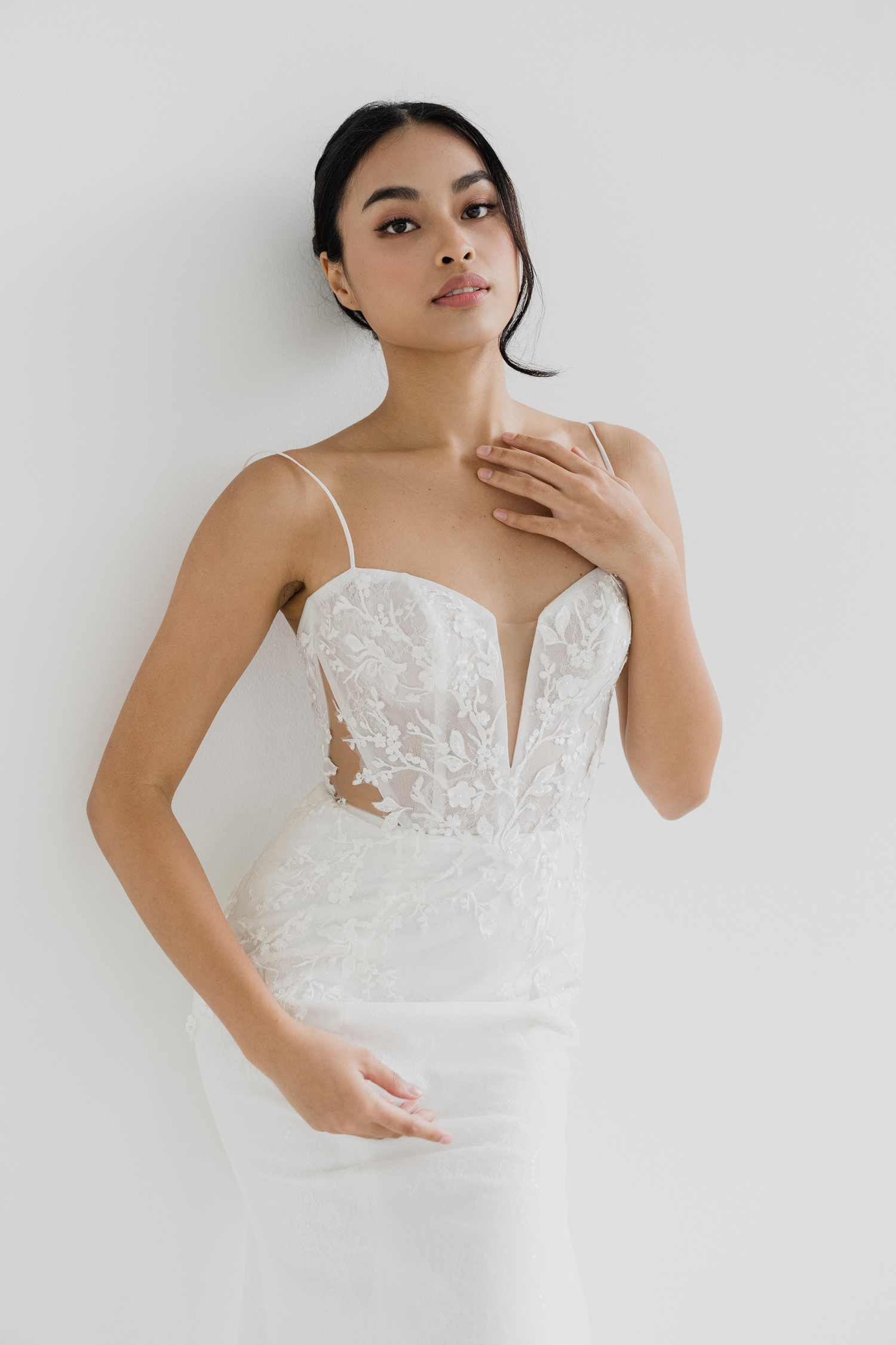 Inez wedding dress front view with spaghetti straps and illusion waist cut-outs