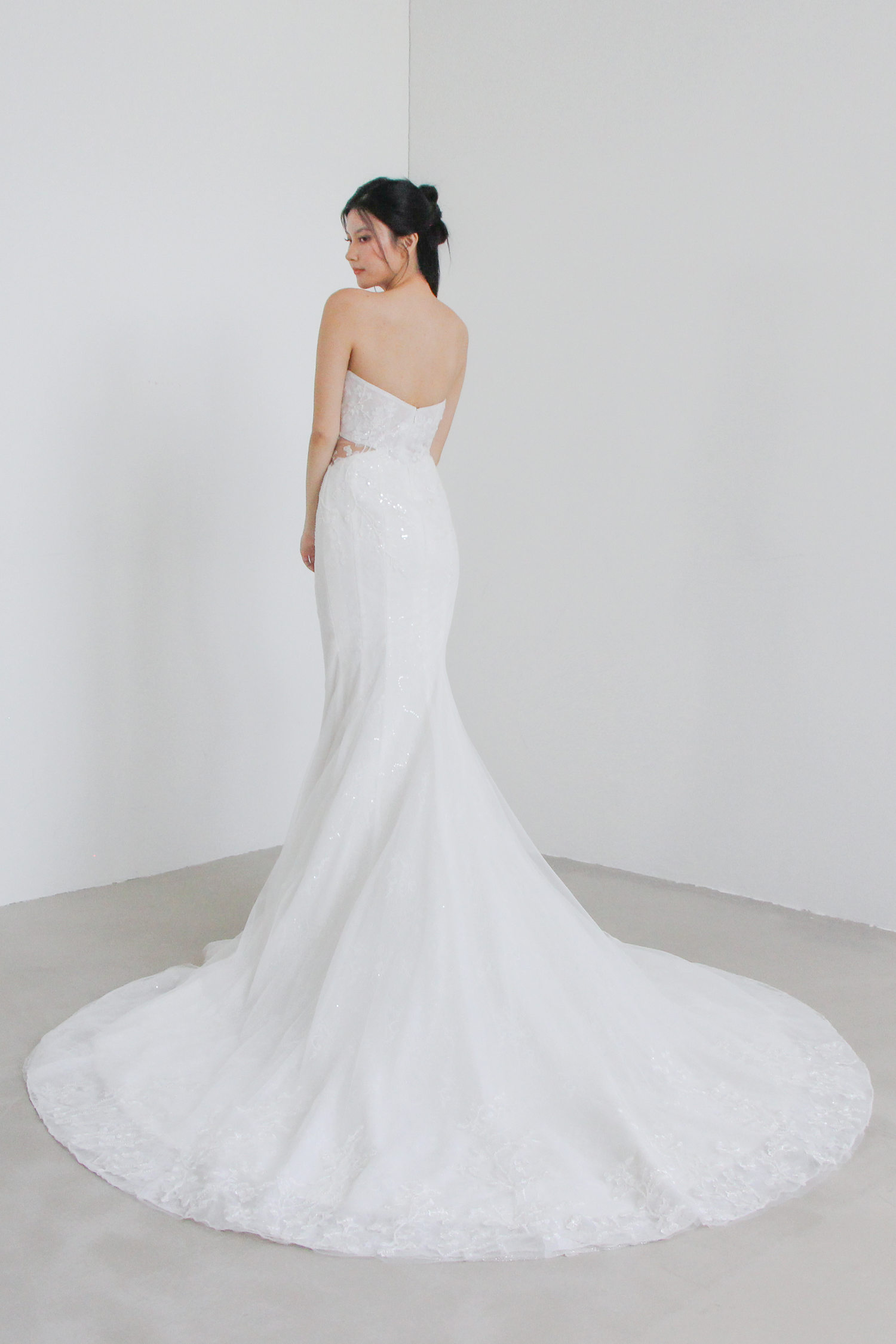 Isadora wedding gown train showcasing intricate floral lace and a graceful flowing train