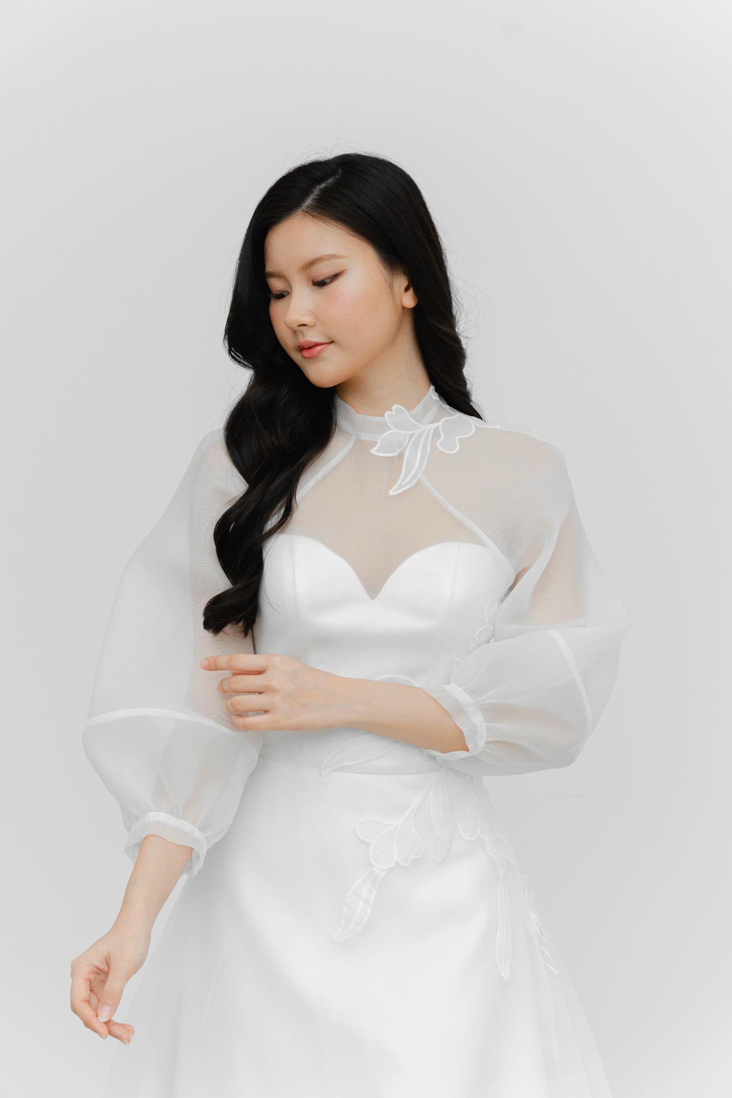 Ivanna wedding dress featuring the detachable organza overlay with flowing sleeves
