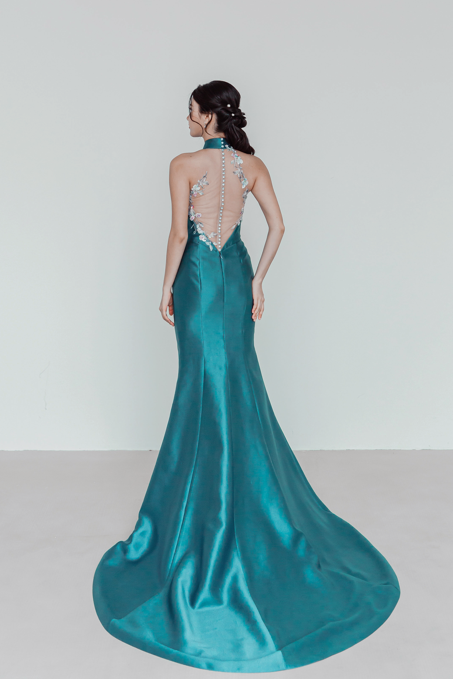 Jade bridal cheongsam back view with an illusion lace back panel