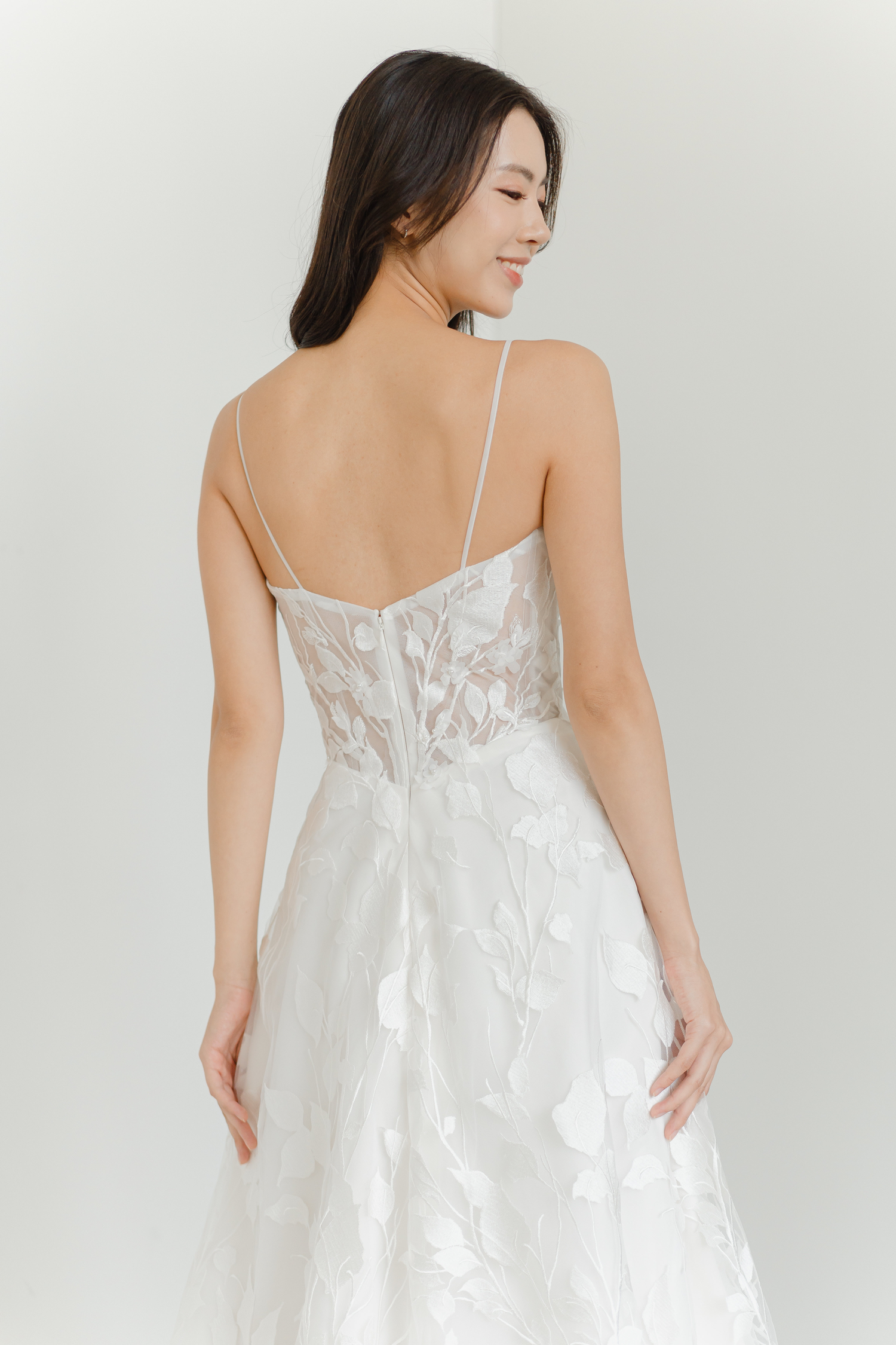Close-up of Jayne wedding dress with intricate leafy lace detailing