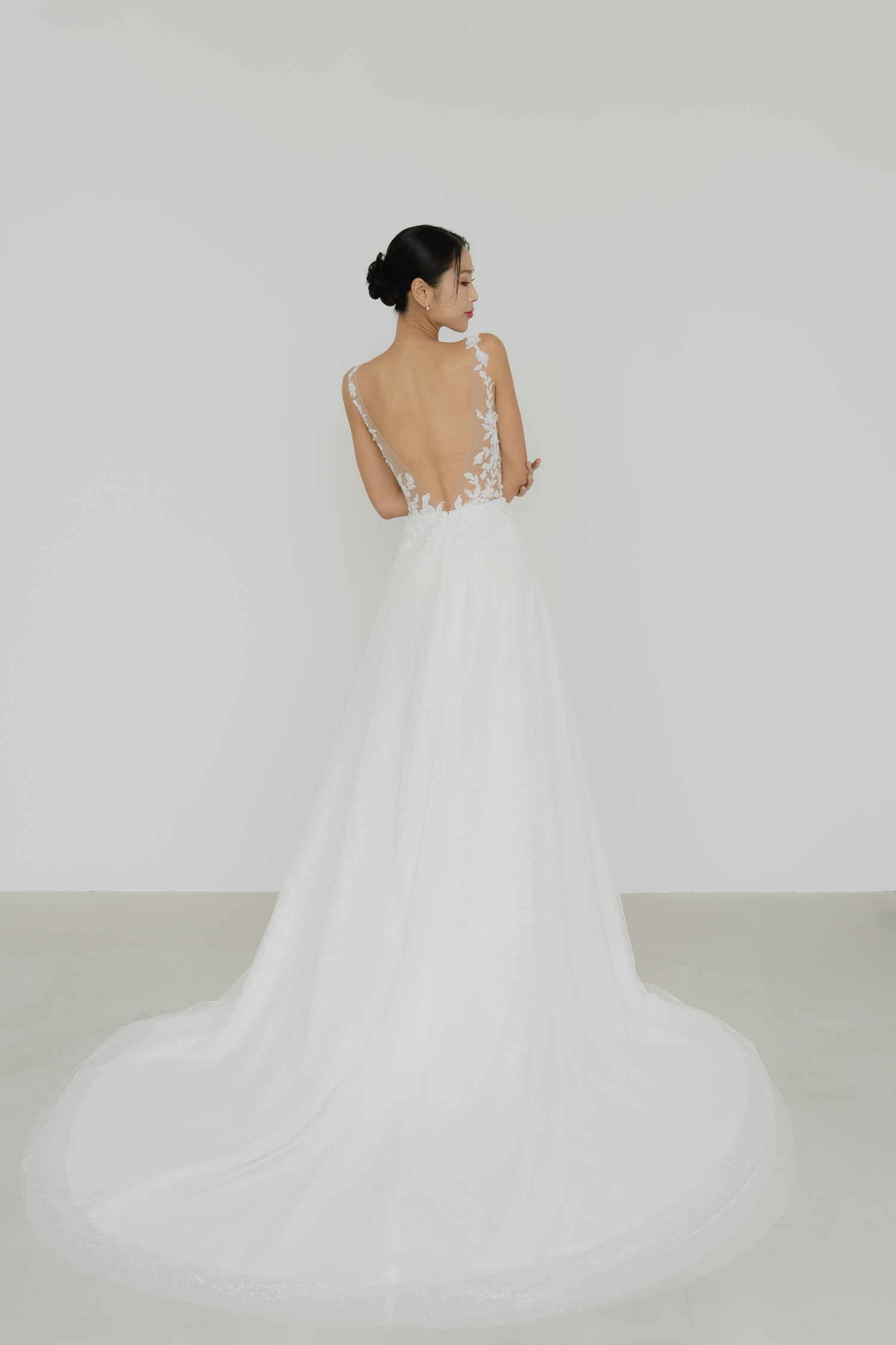 Jenica bridal gown side view showcasing the flowing A-line silhouette