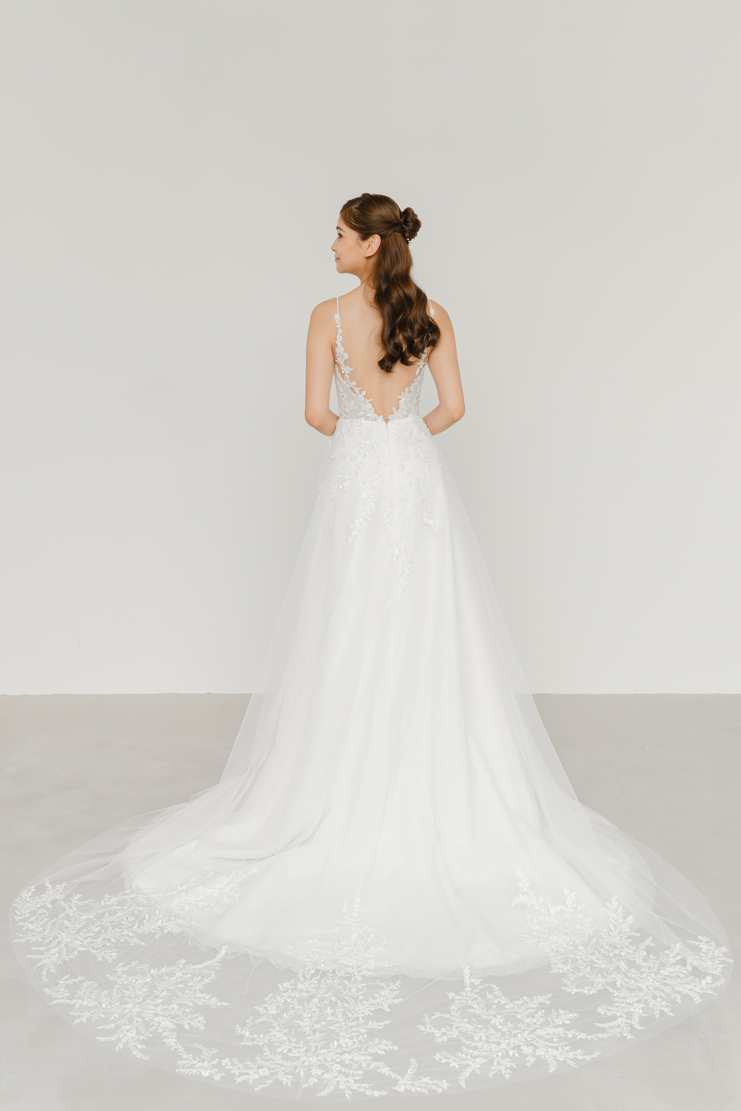 Jorinne wedding gown train showcasing sparkling beaded lace and flowing glitter tulle