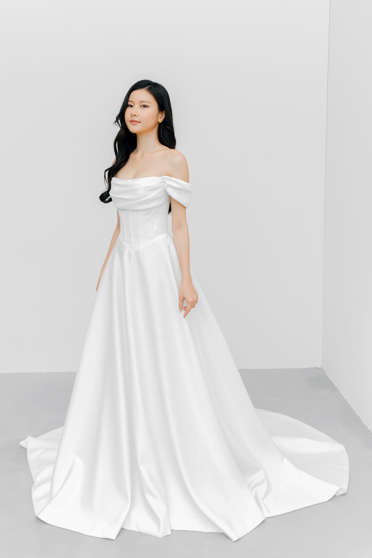 Jovana bridal gown front view with a structured bodice and sculpted V-waist