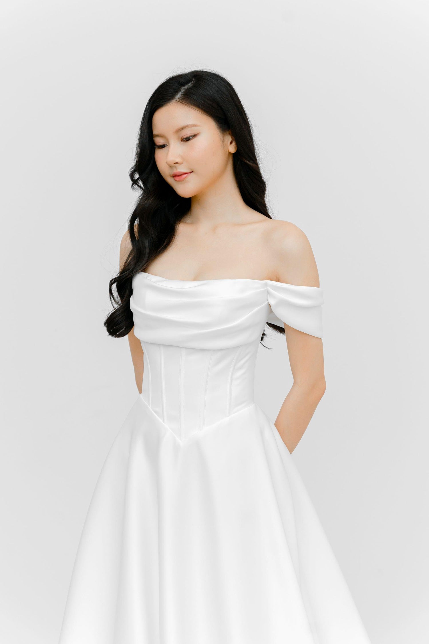 Jovana wedding dress featuring a clean minimalist silhouette and detachable off-shoulder sleeves