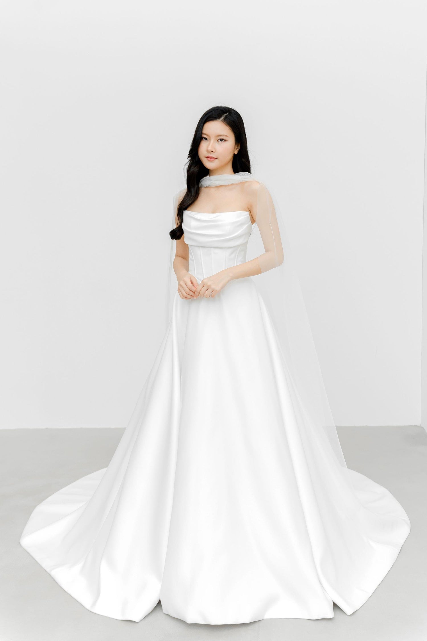 Close-up of Jovana wedding gown highlighting the detachable tulle scarf