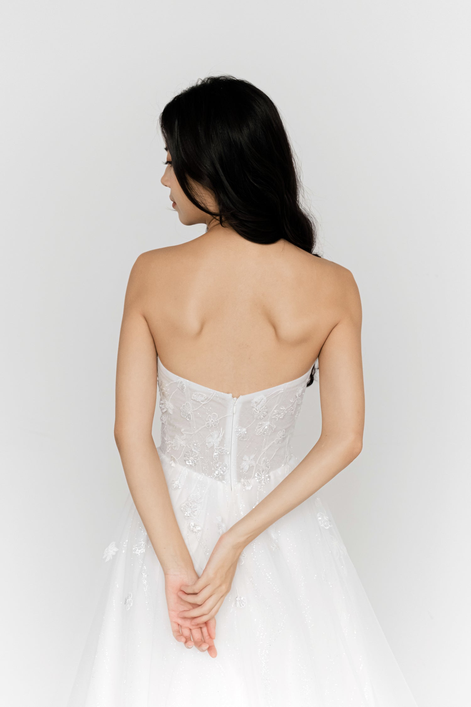 Judith bridal gown back view with a flowing silhouette