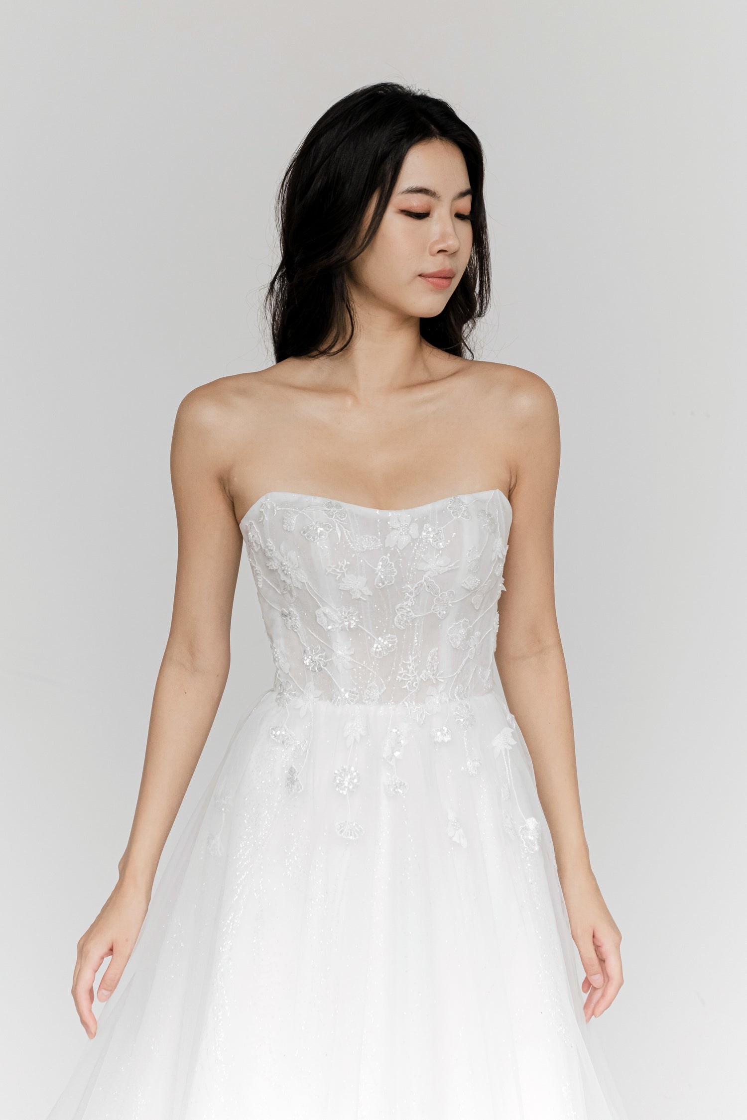 Judith wedding dress front view with a graceful scoop neckline and glitter ballgown silhouette