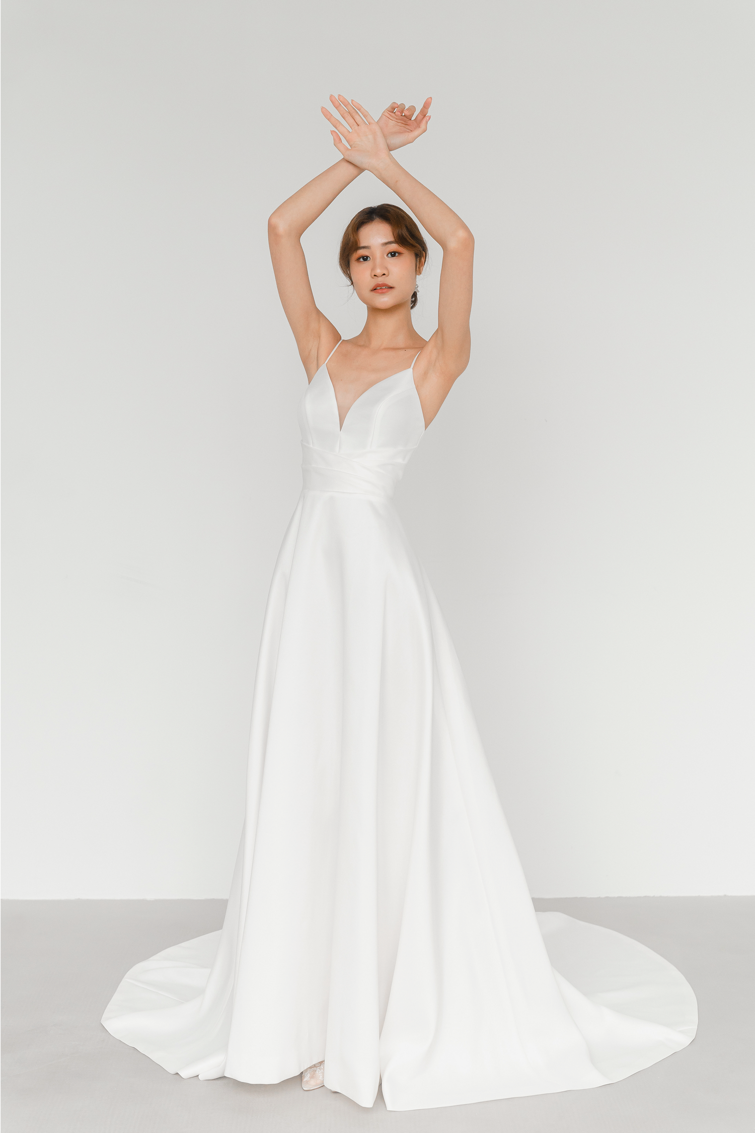 Julia wedding dress front view with a V-neckline and spaghetti straps