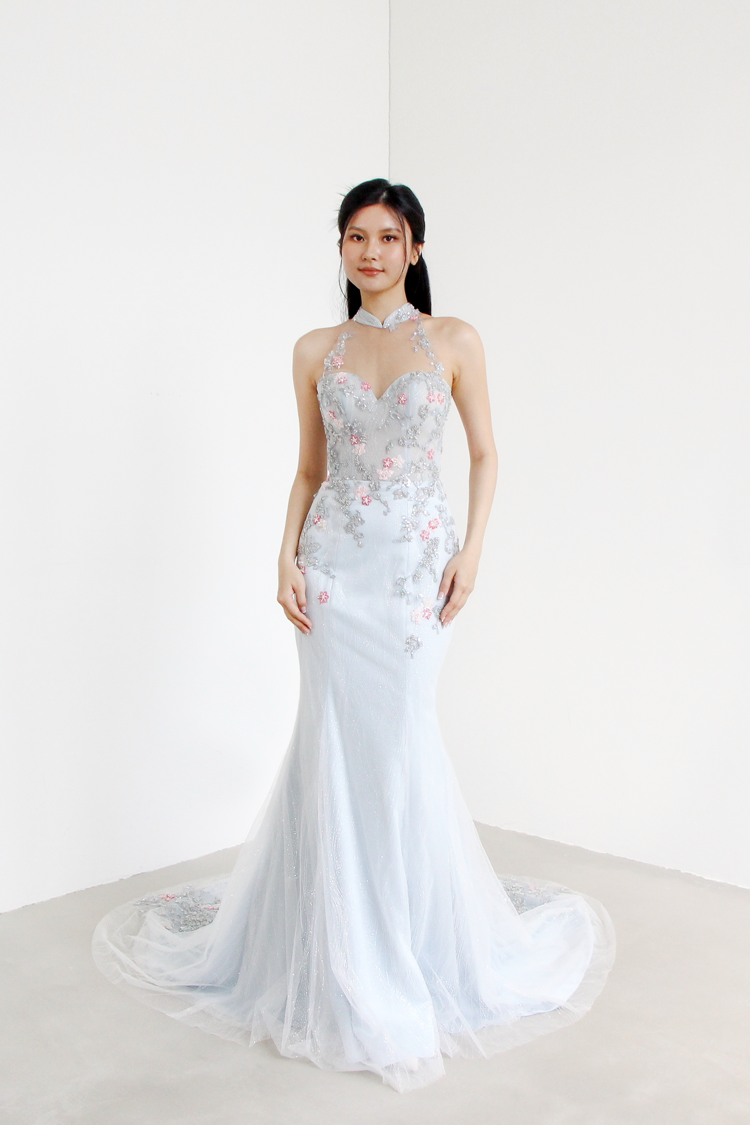 Kaira bridal cheongsam featuring intricate silver beaded lace and delicate pink floral accents