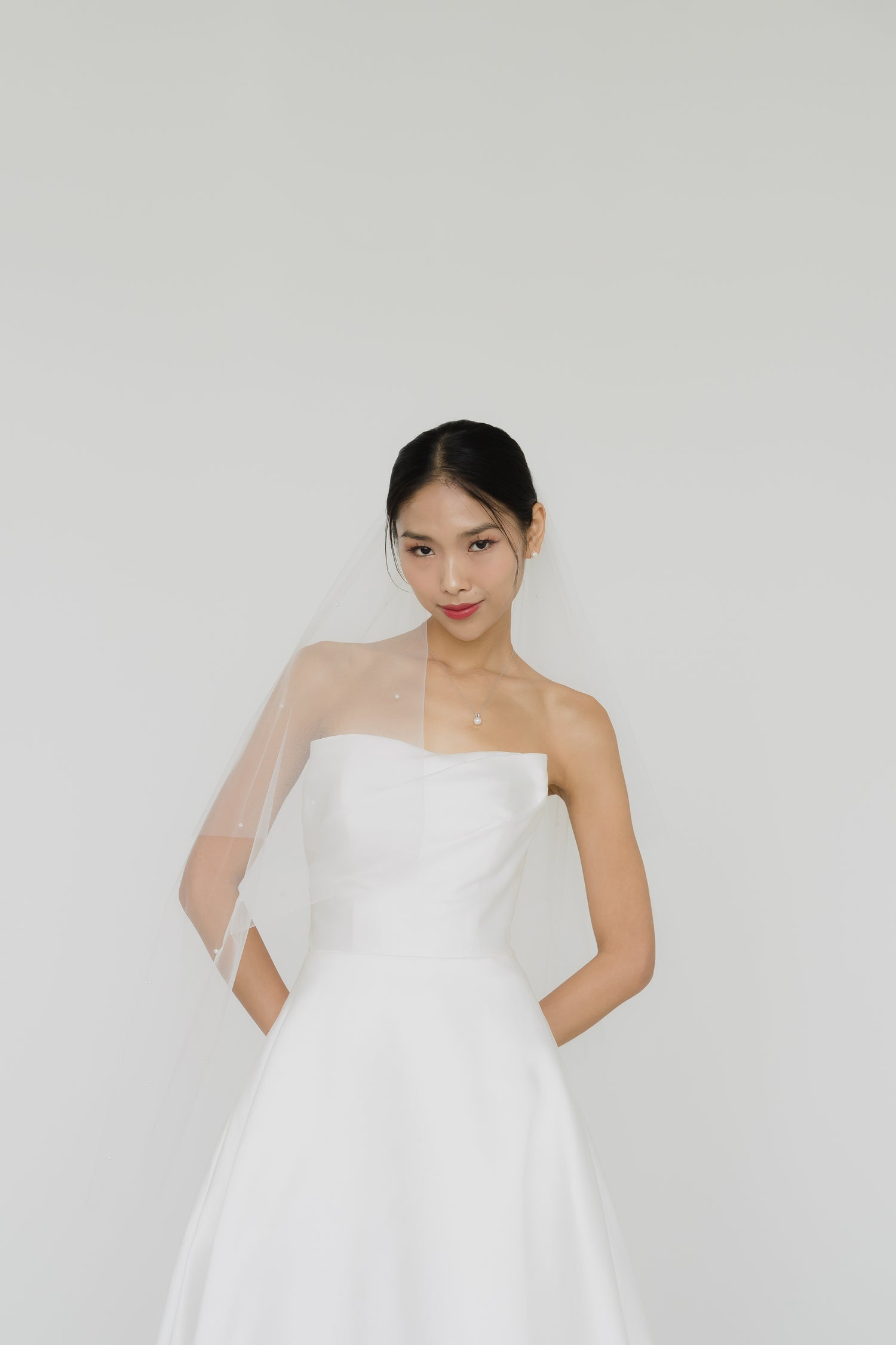 Kendra bridal gown front view with a structured bodice and elegant A-line silhouette