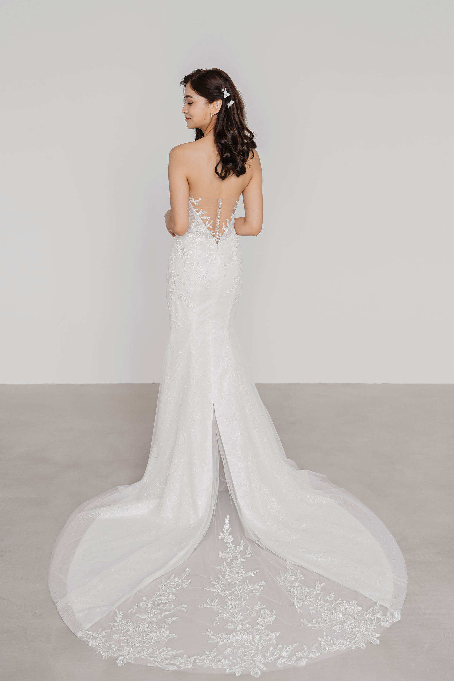 Kezia bridal gown featuring a train with delicate peekaboo lace detailing