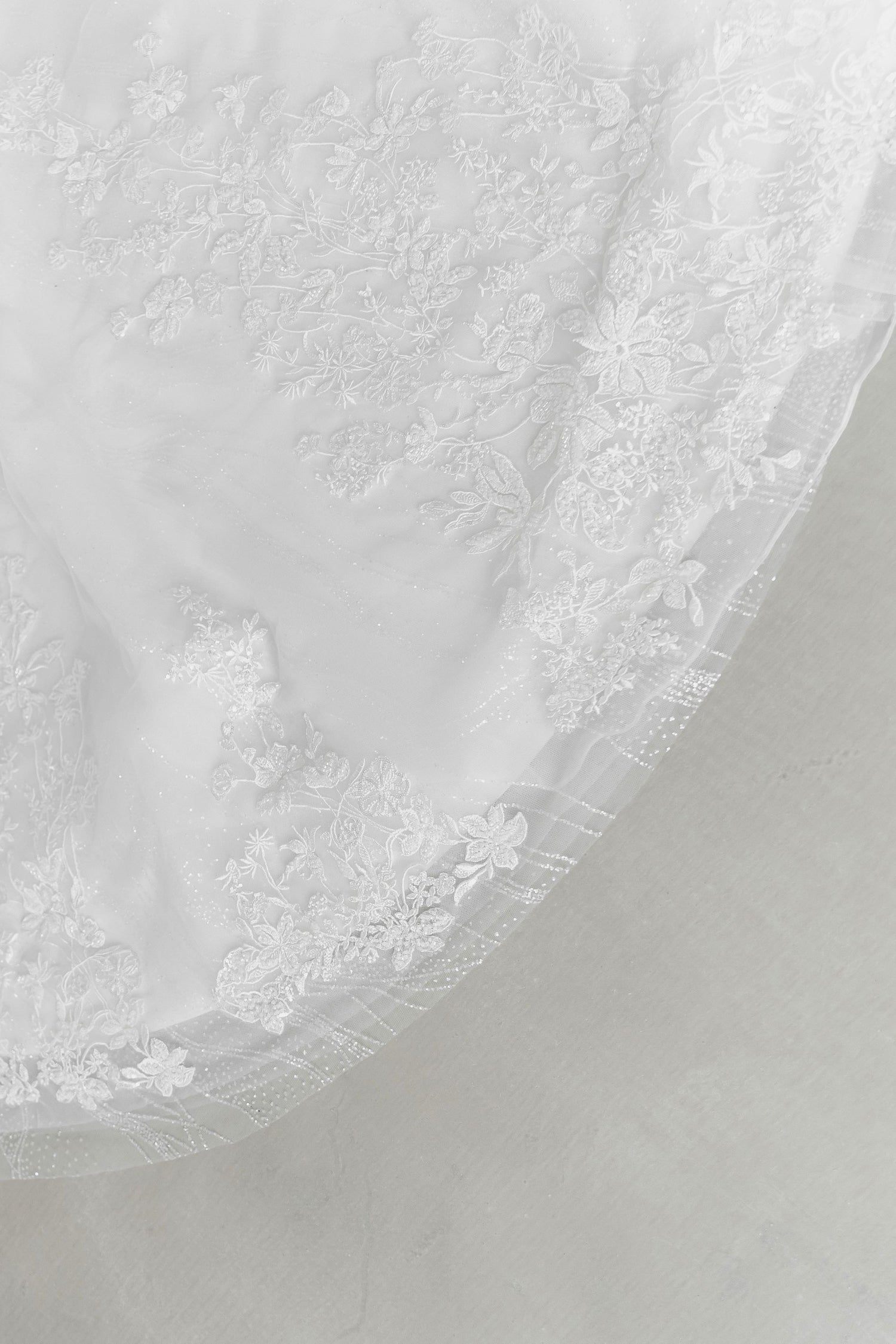 Close-up of Kimber wedding dress highlighting the shimmering glitter fabric