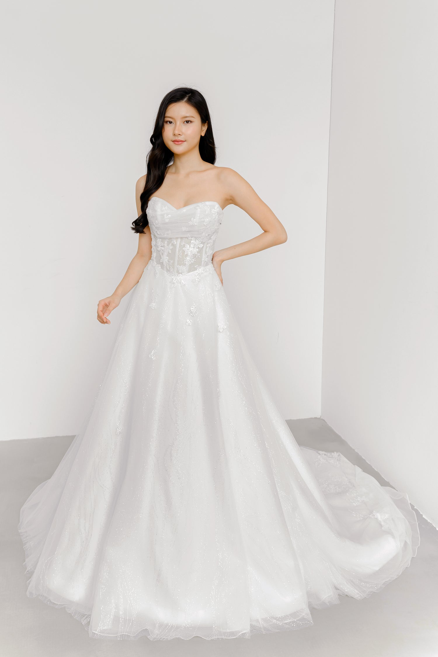 Kimber wedding dress front view with a shimmering glitter silhouette