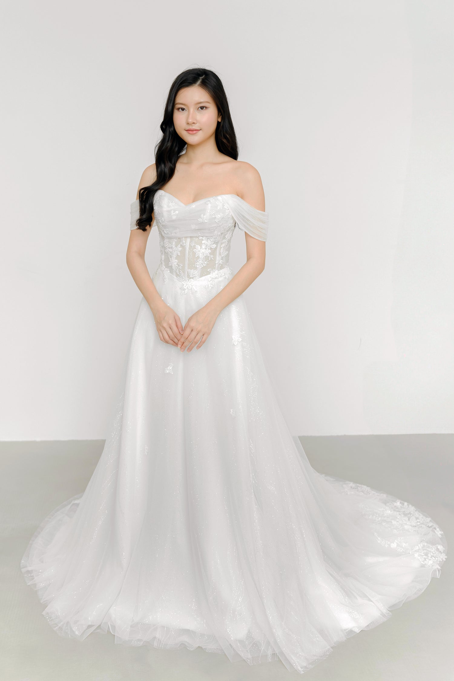 Close-up of Kimber wedding gown highlighting the detachable off-shoulder sleeves