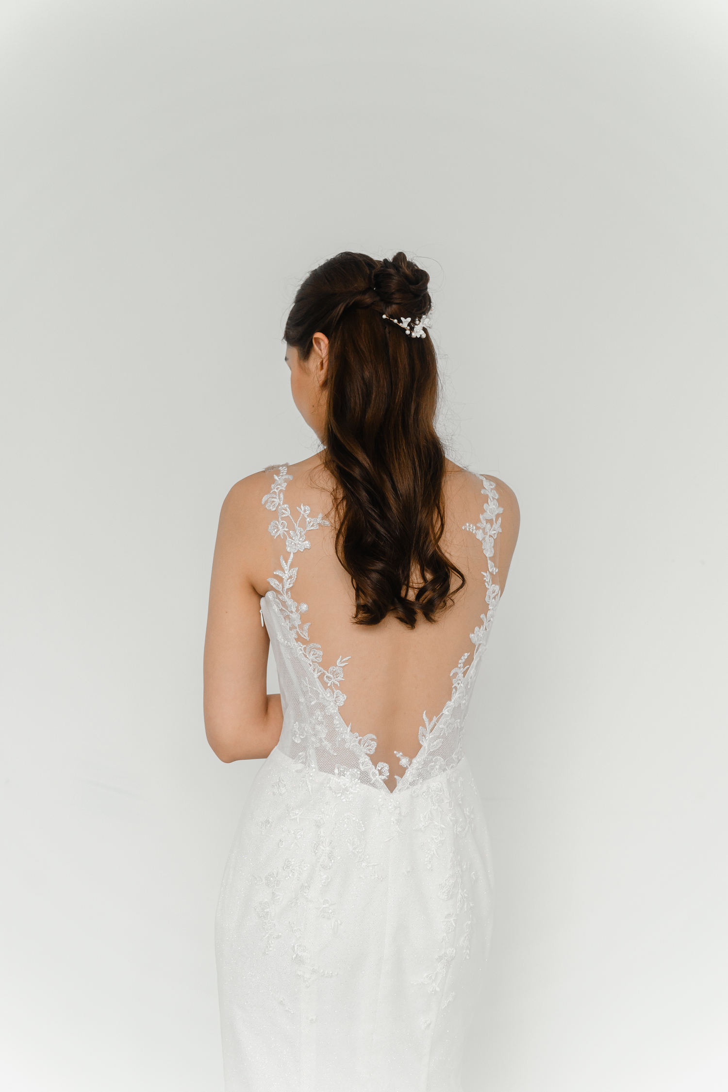 Close-up of Kinsley wedding dress showcasing the low illusion back