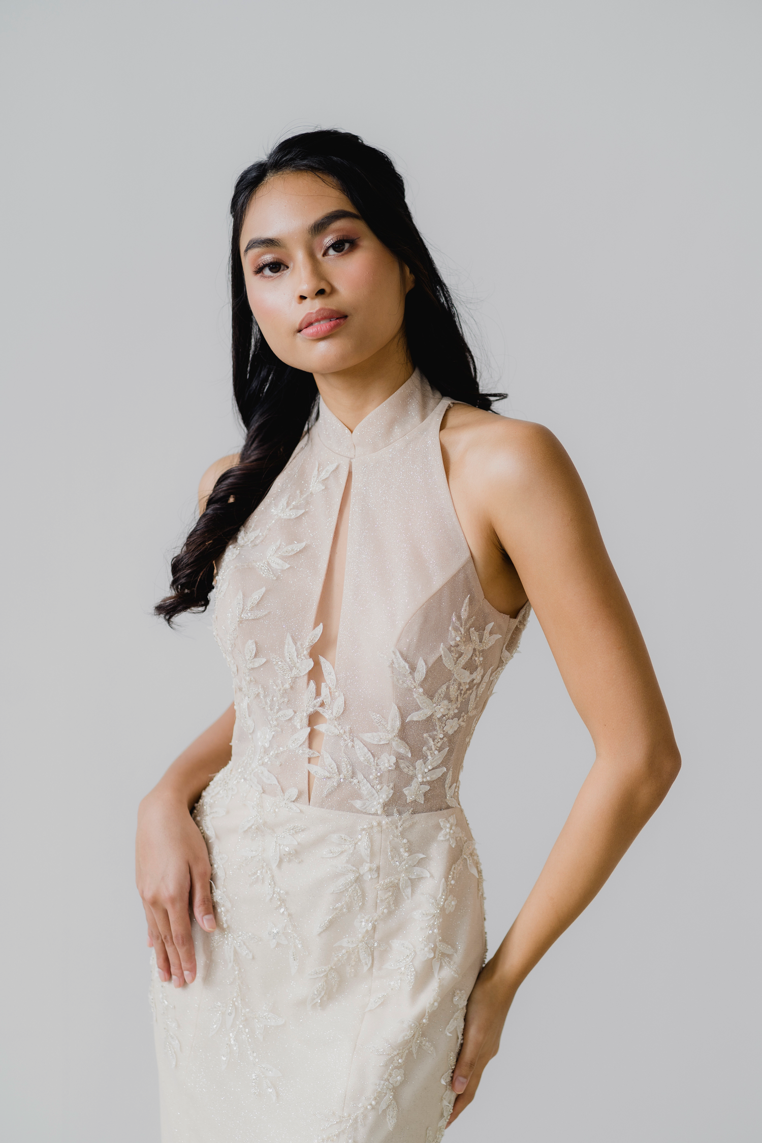 Close-up of Kristine wedding cheongsam with delicate leafy beadwork